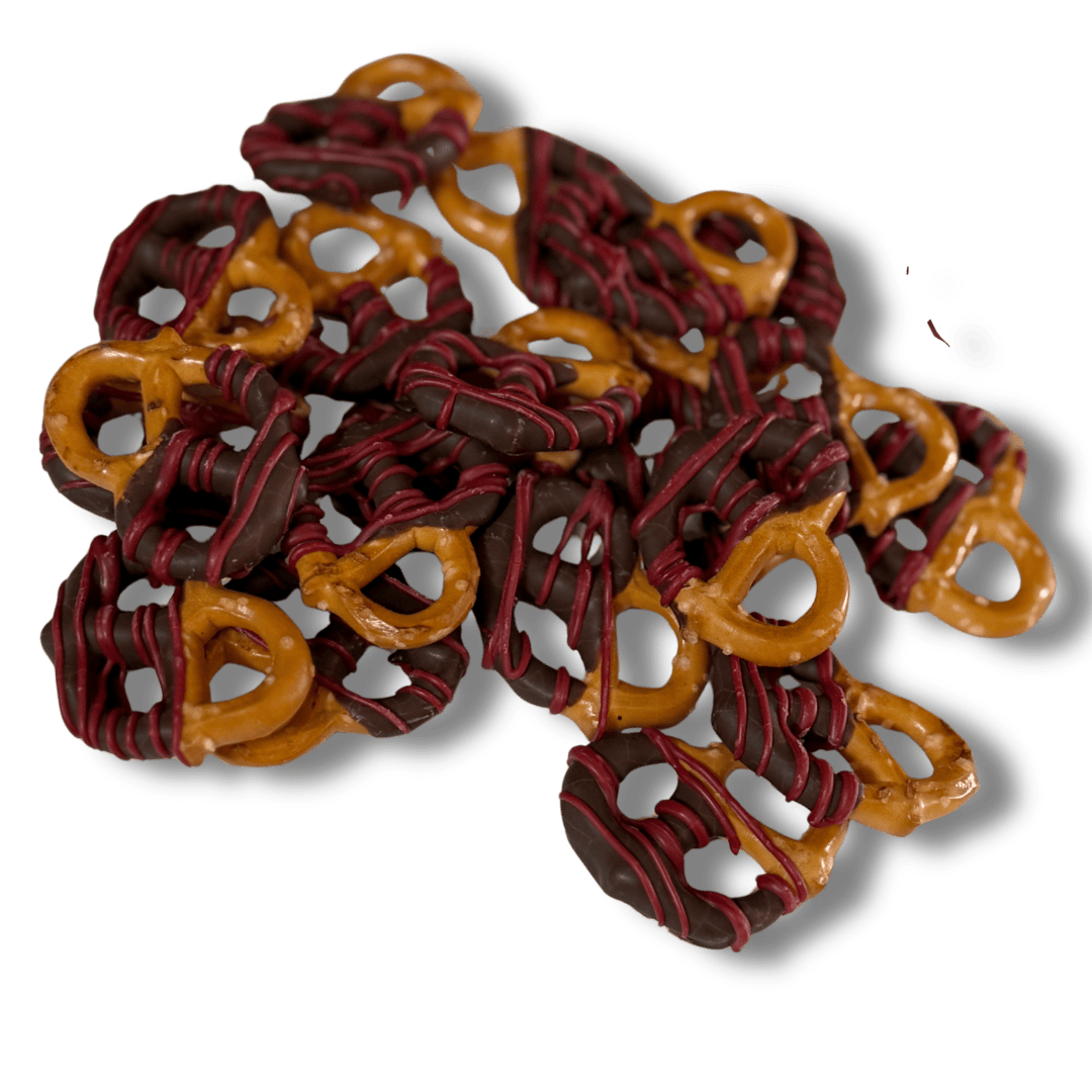 Chocolate-dipped pretzels drizzled with red and dark chocolate.