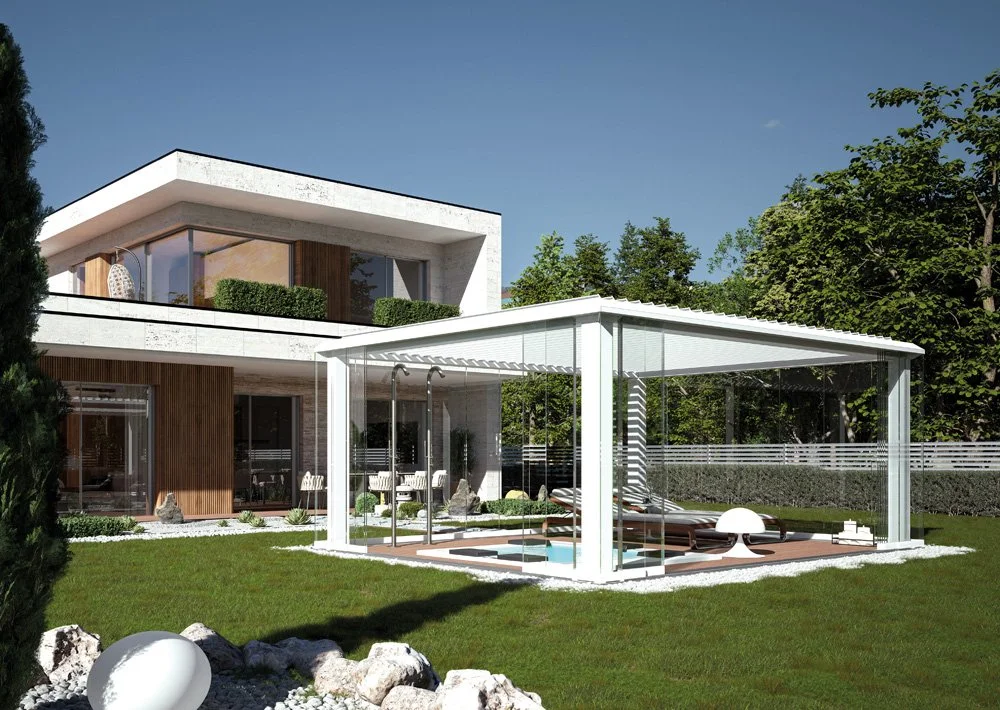 Modern two-story house with glass porch and pool area, surrounded by green lawn, trees, and outdoor furniture.
