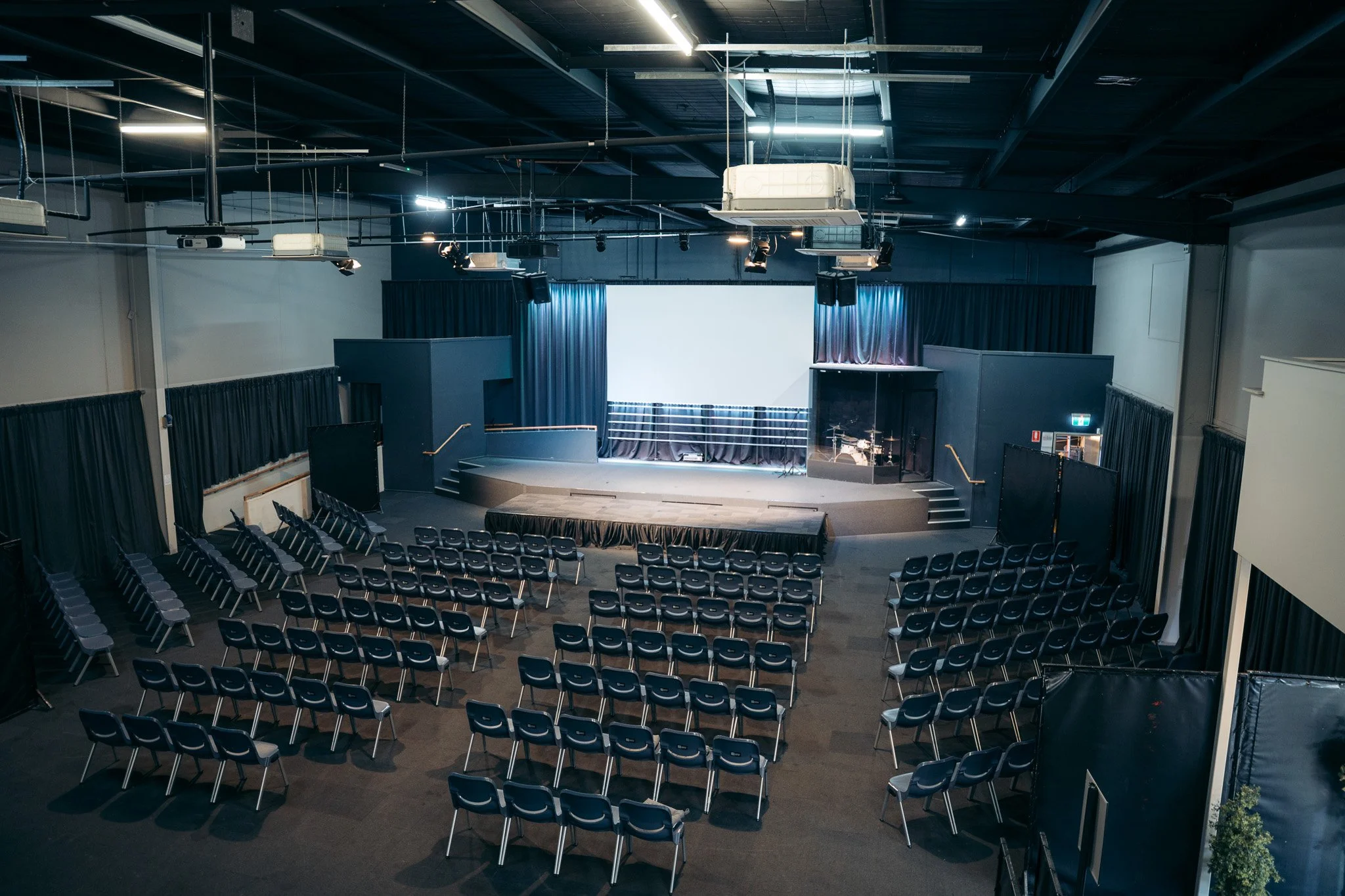 Large event venue in Caloundra with stage, seating and presentation screen, available for conferences, events and community gatherings on the Sunshine Coast.