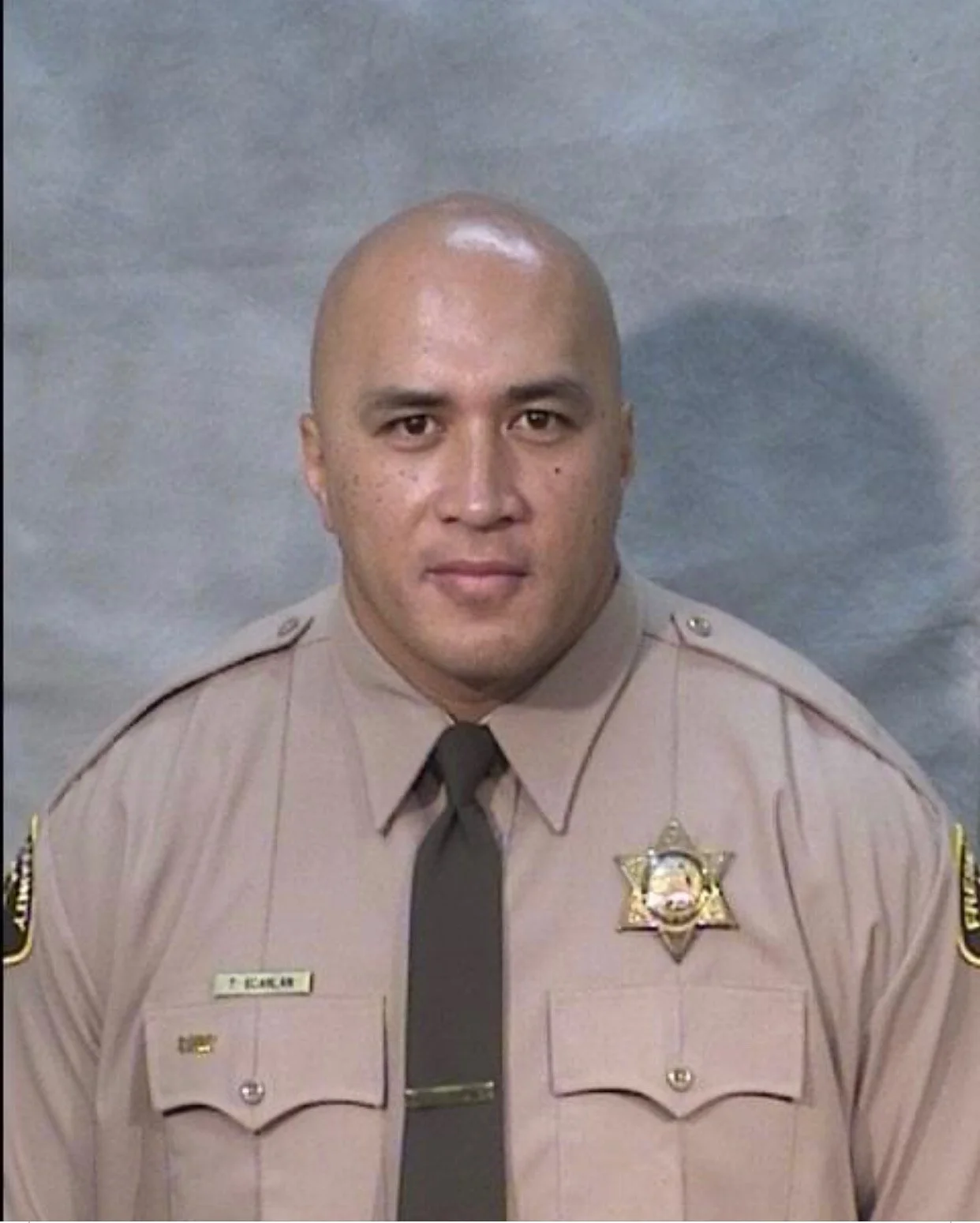 Portrait Fresno County Correctional Officer Malama Scanlan in a sheriff uniform.