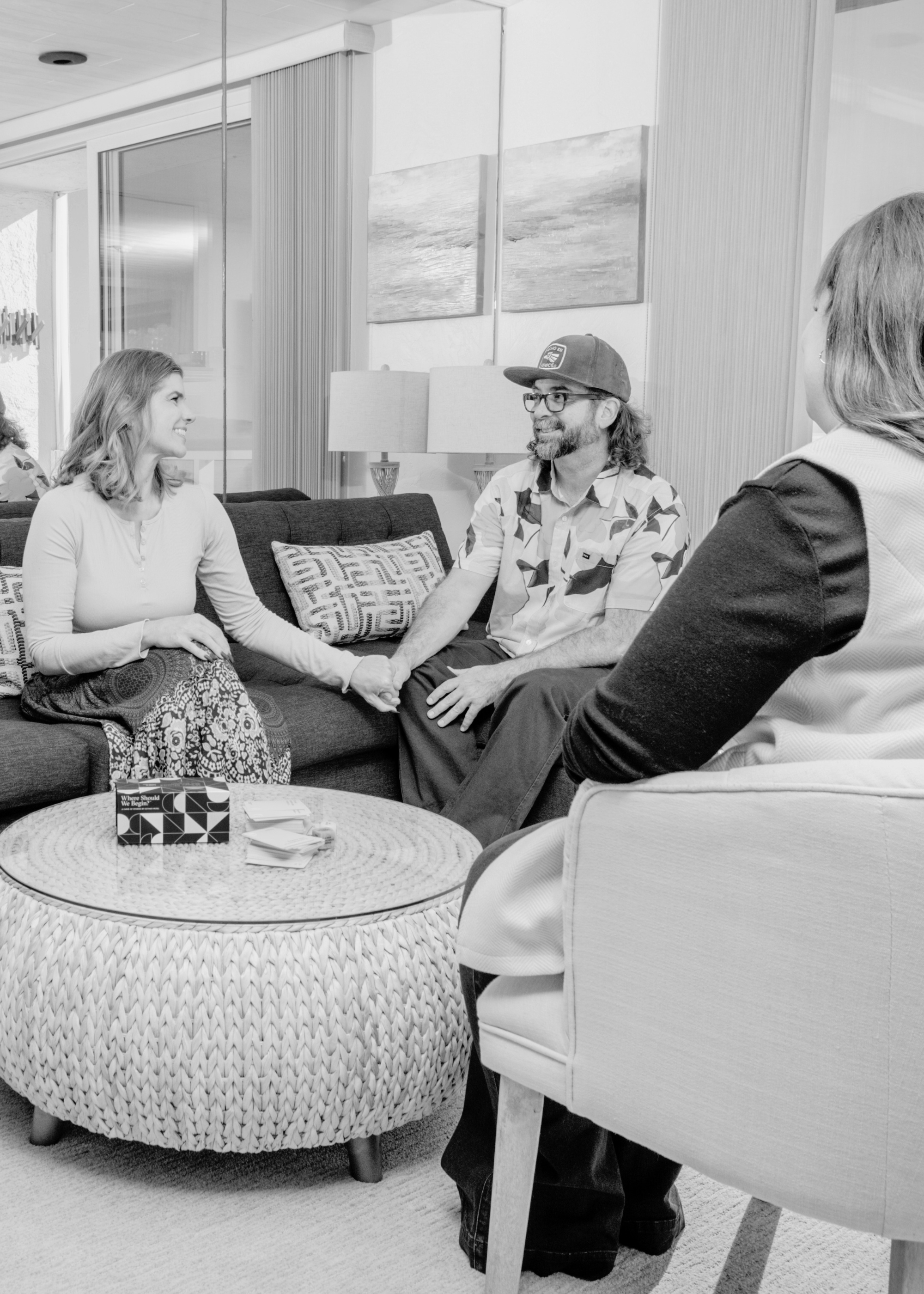 A couple and affair recovery coach discussing marriage therapy for infidelity.