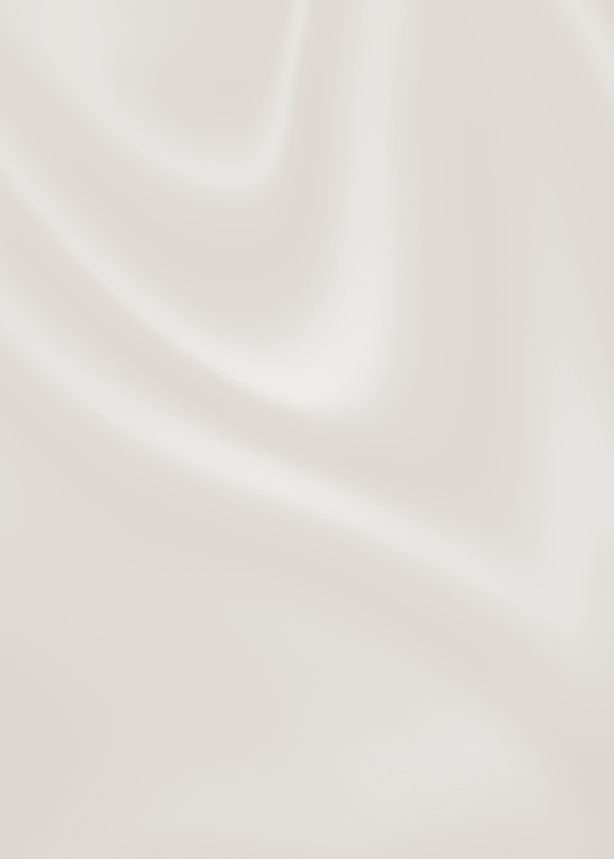 A plain, light-colored, possibly cream or beige, silky fabric with soft folds and smooth texture.
