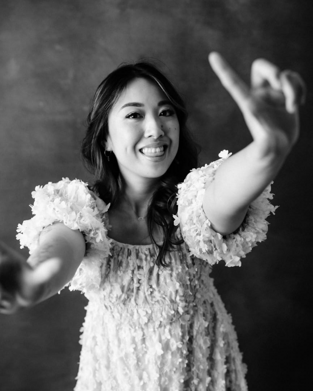 Debra, the photographer behind Hey Lovely Boudoir by Deb, posing for a series of portraits