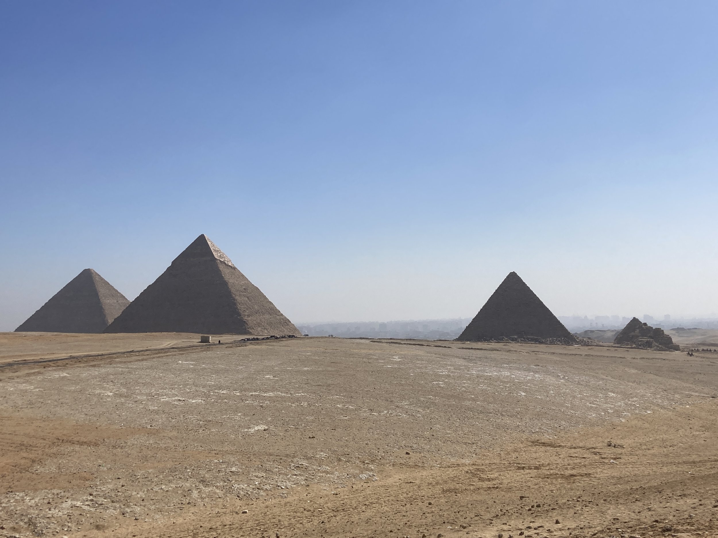 Pyramids of Giza in the Egyptian desert with a clear blue sky
