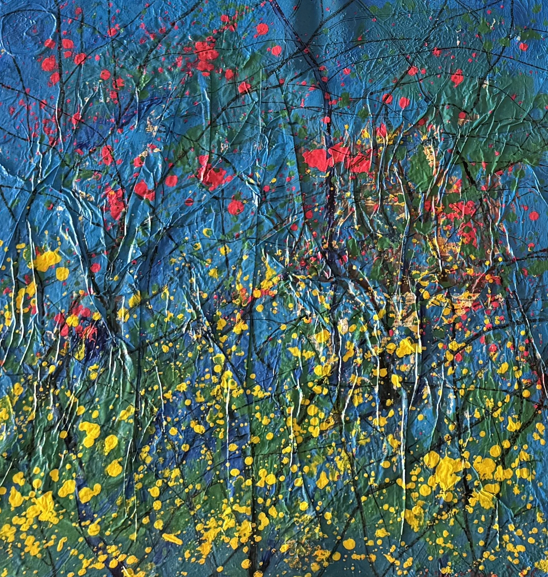 Abstract artwork with a textured blue background and colorful splatters of red, yellow, and green paint, with black and white lines crossing the image.