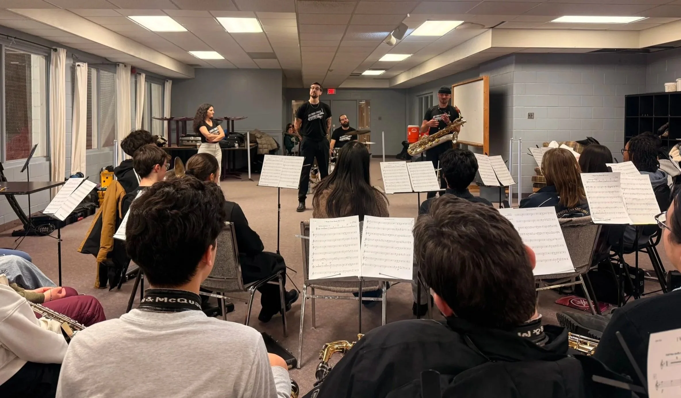Big Smoke Brass conduction a clinic for middle school students at a band retreat.