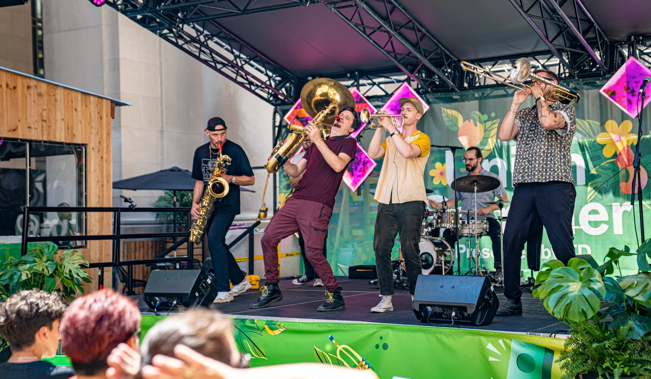 Big Smoke Brass on stage at TD Union Stummer infront of Union Station on a hot day in summer.
