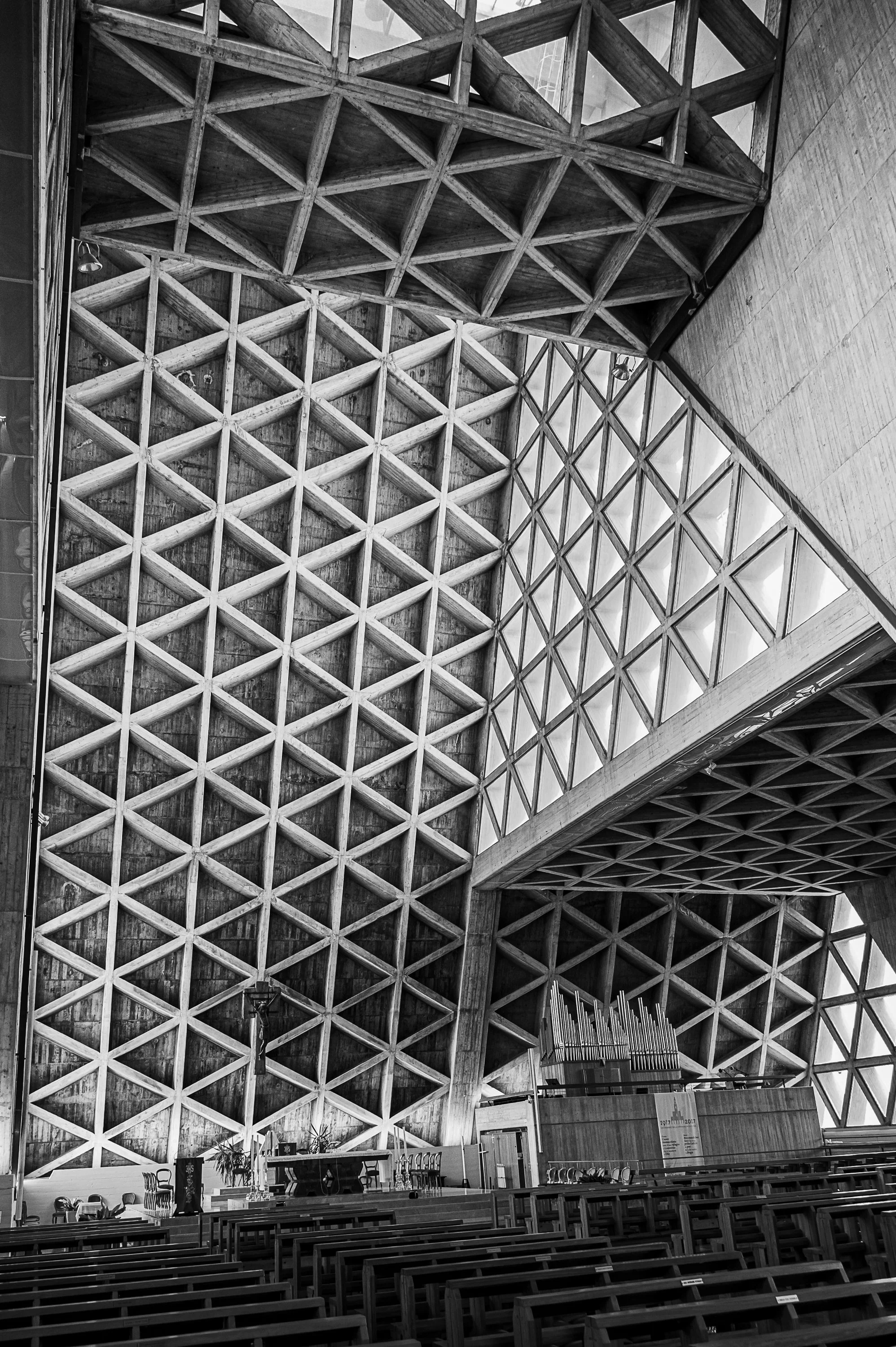 Geometric concrete grid and triangular windows. Opens the Concrete Silence series.