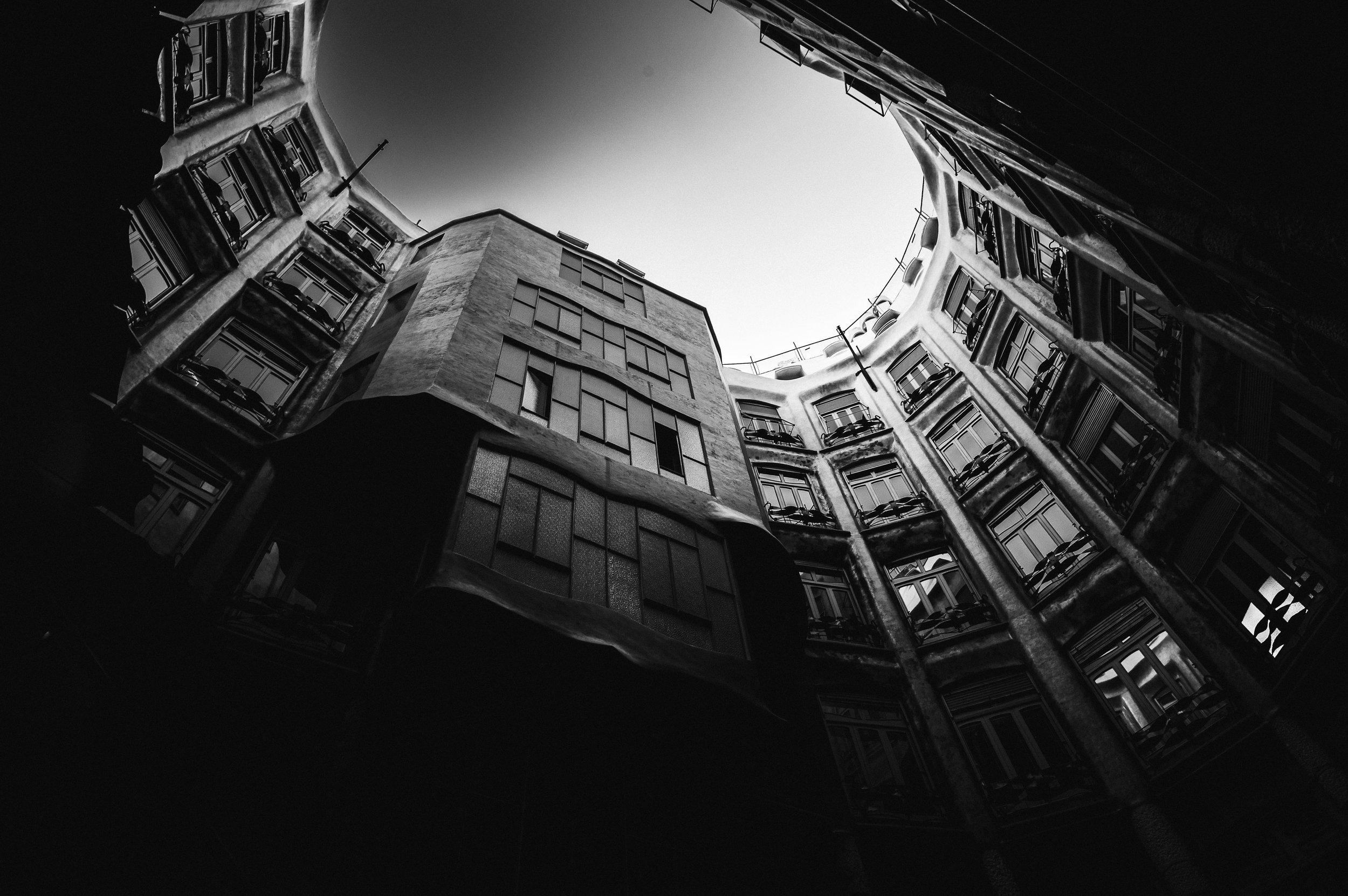 Curved facades surrounding a fragment of sky