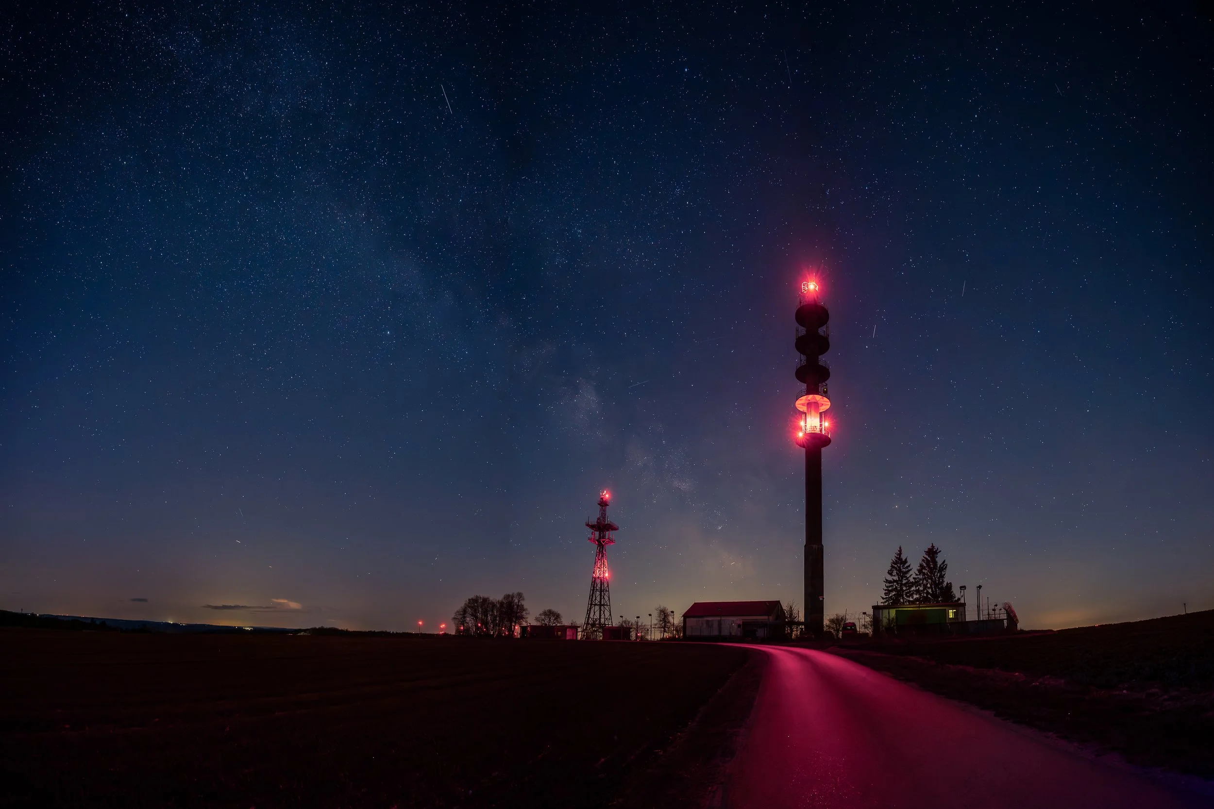 Red lights dissolving into the night landscape