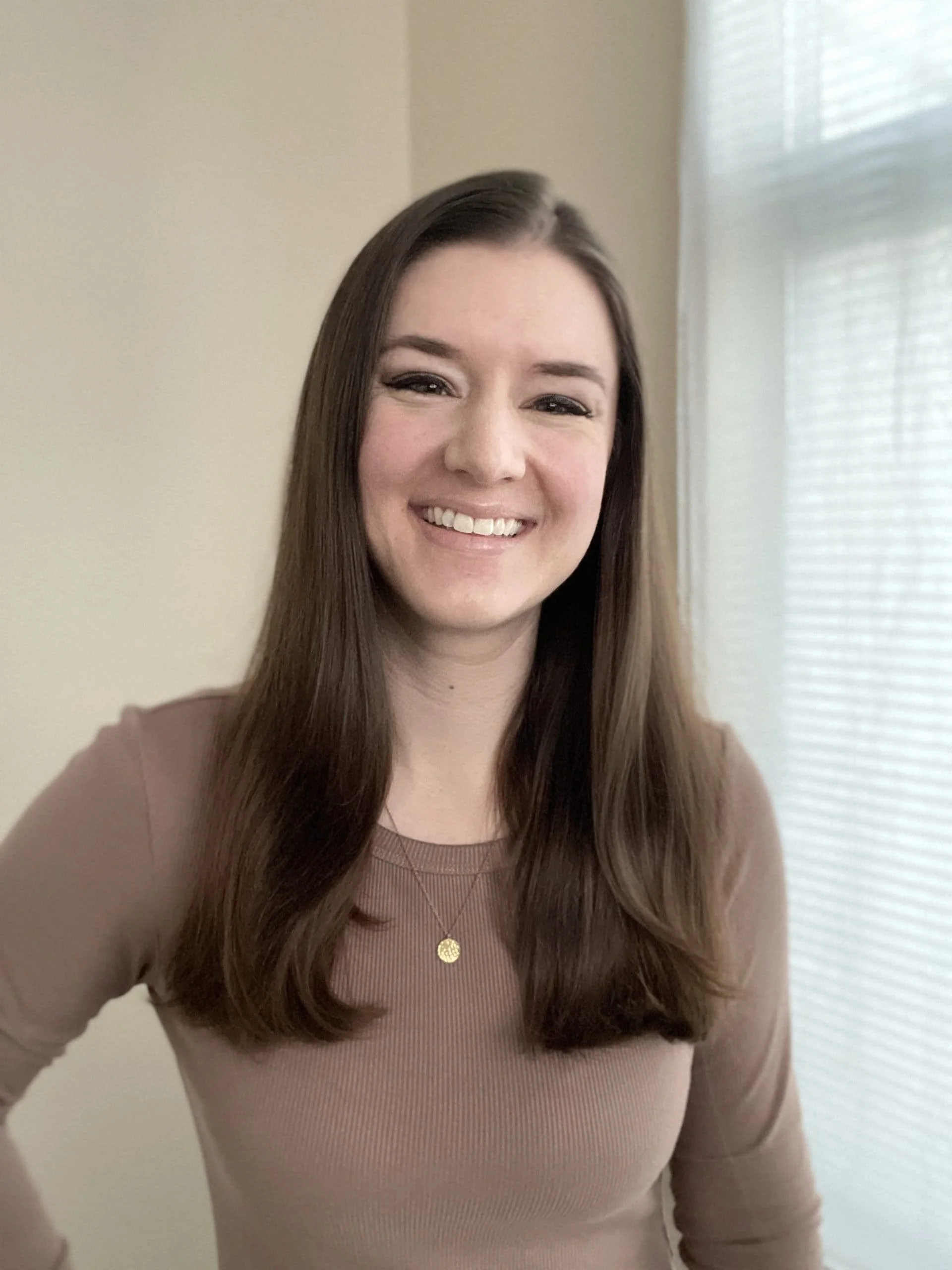 Katie Harp in beige shirt
