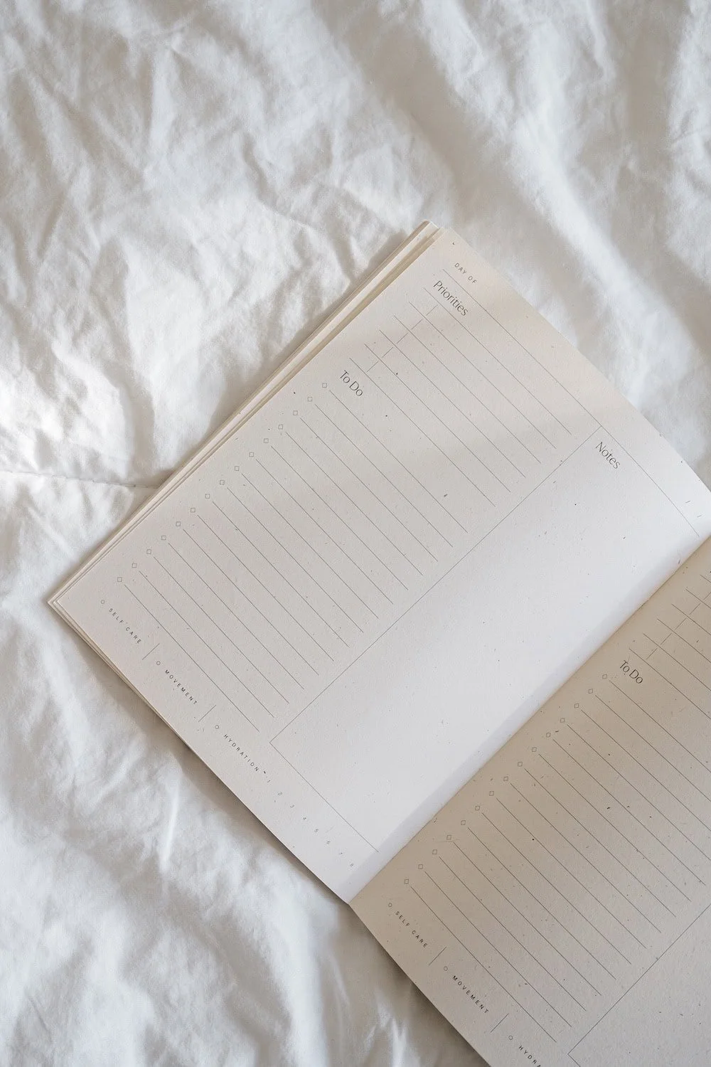 Notebook on white sheet