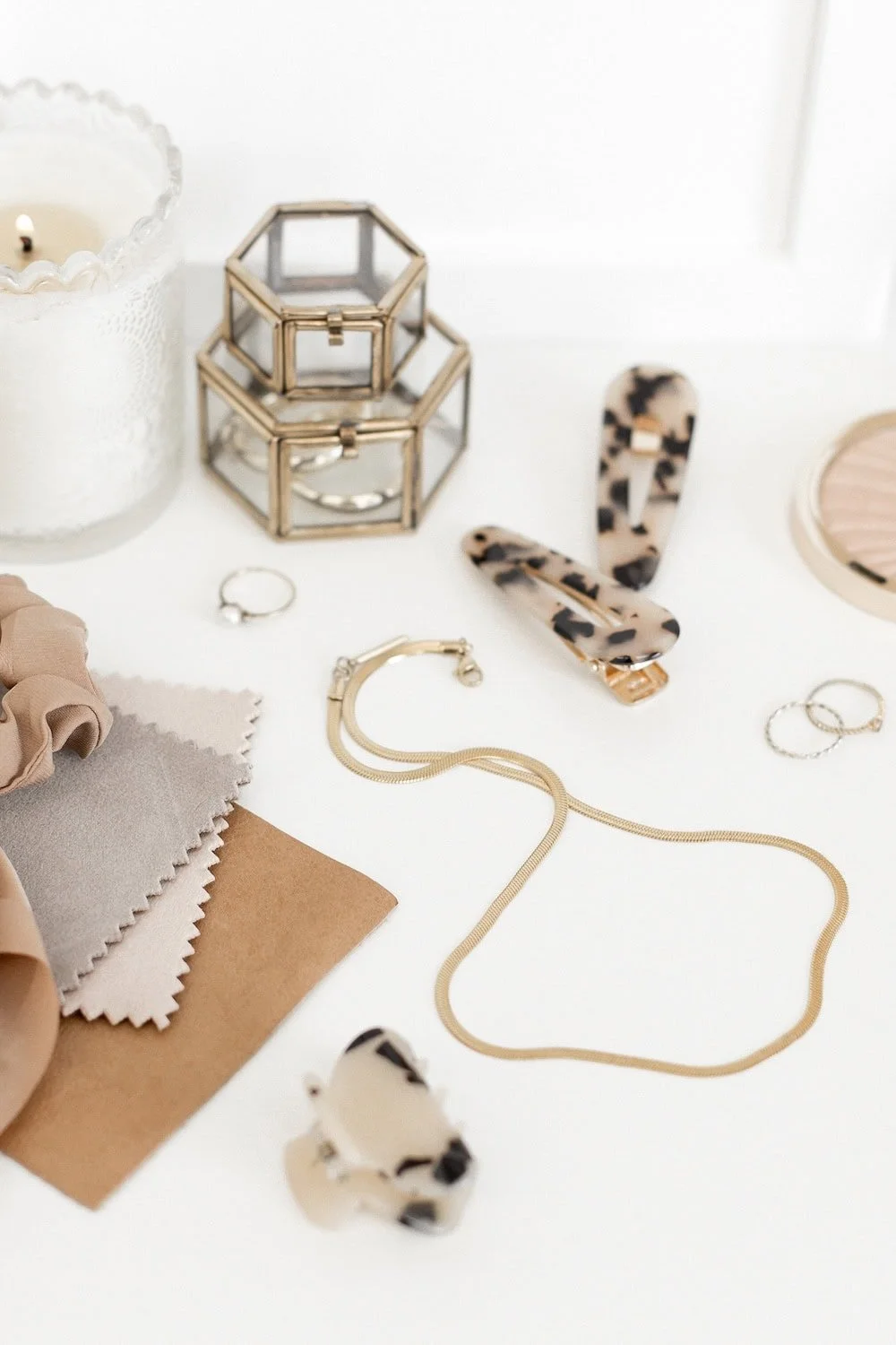 Necklace and candle on a table