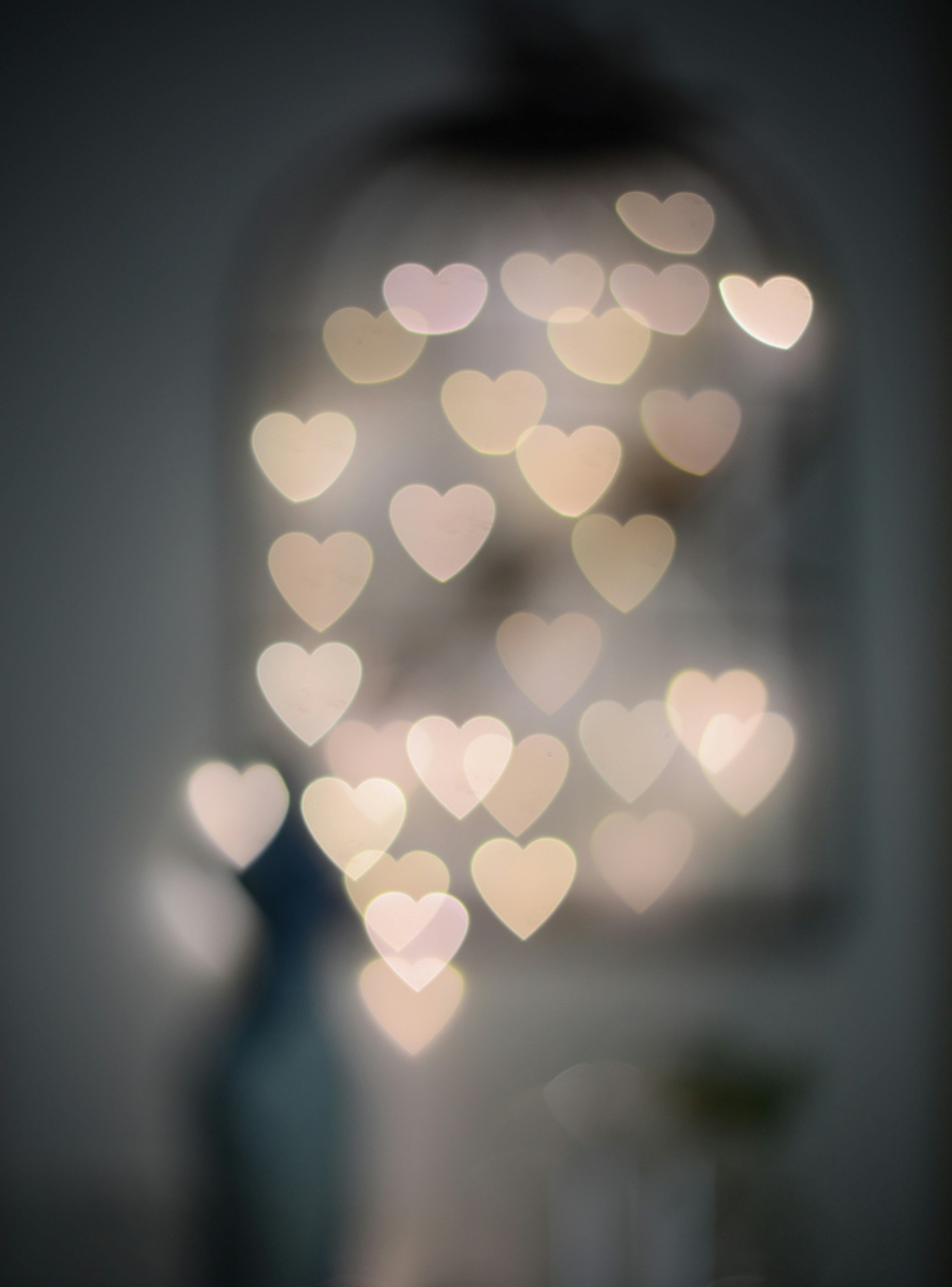 Blurred image of a decorative string of heart-shaped lights