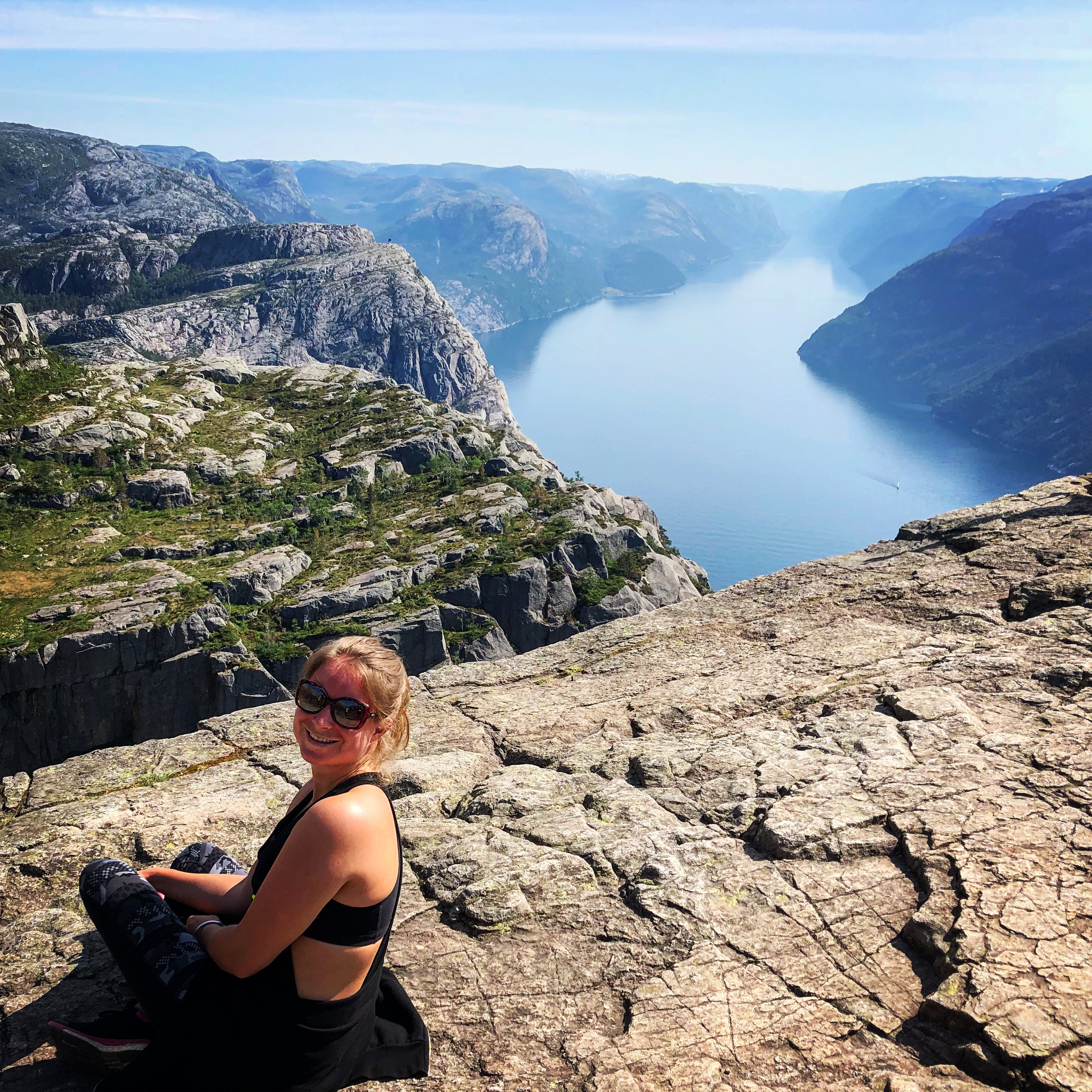 Plan My Trip founder Katherine Richardson at Preikestolen (Pulpit Rock), Norway, showcasing 15 years of global travel expertise and destination knowledge