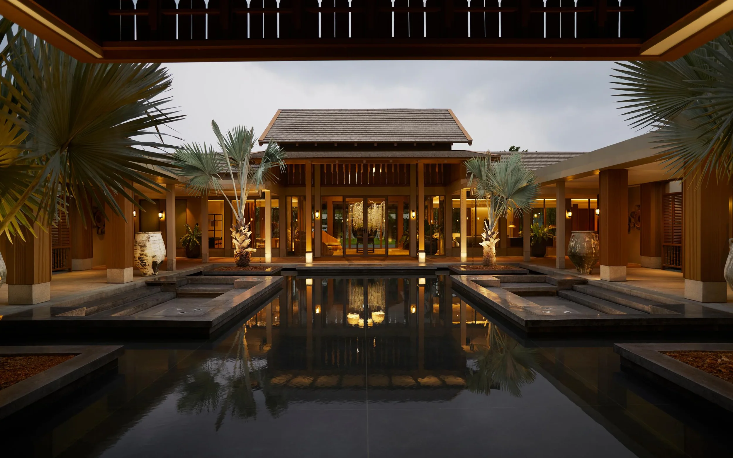 A peaceful, hotel surrounded by a quiet forest showcasing the hushpitality silent travel trend.