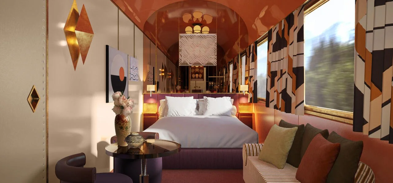 Five-star dining car on a luxury European sleeper train featuring white tablecloths and mountain views