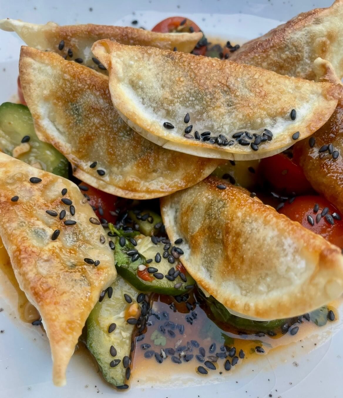 Gyoza Greek salad 

Think a Greek salad x smoked cucumber salad x gyoza 

These are fresh, indulgent, crunchy, spicy and salty, and it takes about 15 mins to make. 

- Mix 1.5tbsp crispy chilli oil (do less if you don&rsquo;t like spice), 3tbsp soy s