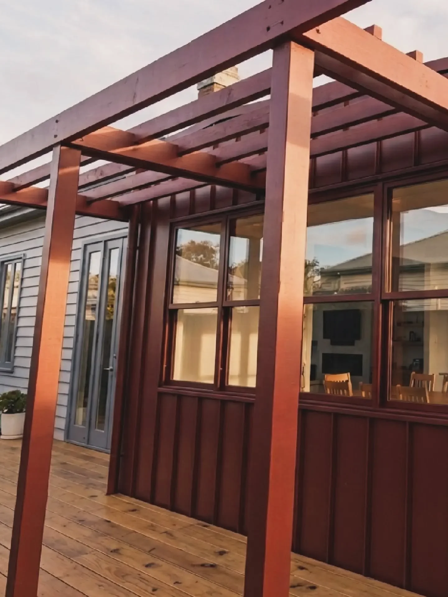 The extension introduced a larger kitchen, an expanded bathroom and laundry, and a dedicated powder room. Spaces that quietly transform day-to-day living. The standout moment is a custom banquette seat dining area; an intimate, considered nook that m