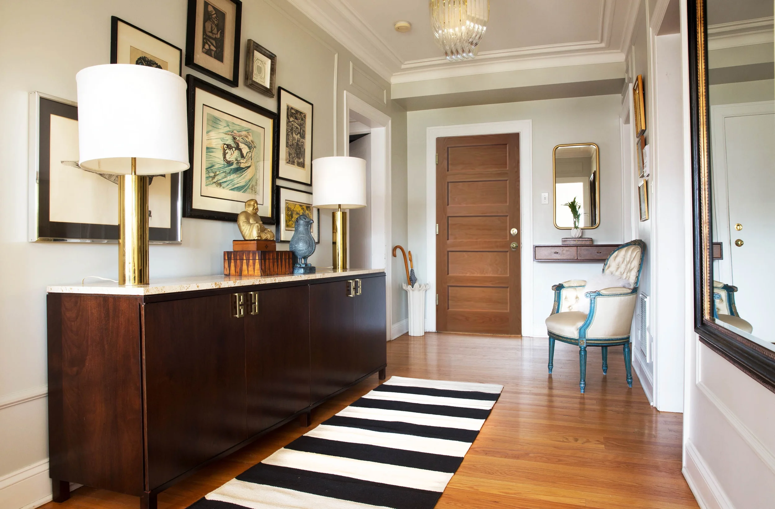 condo entry hallway with gallery wall art