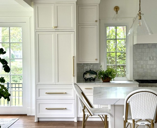white kitchen with brass hardware