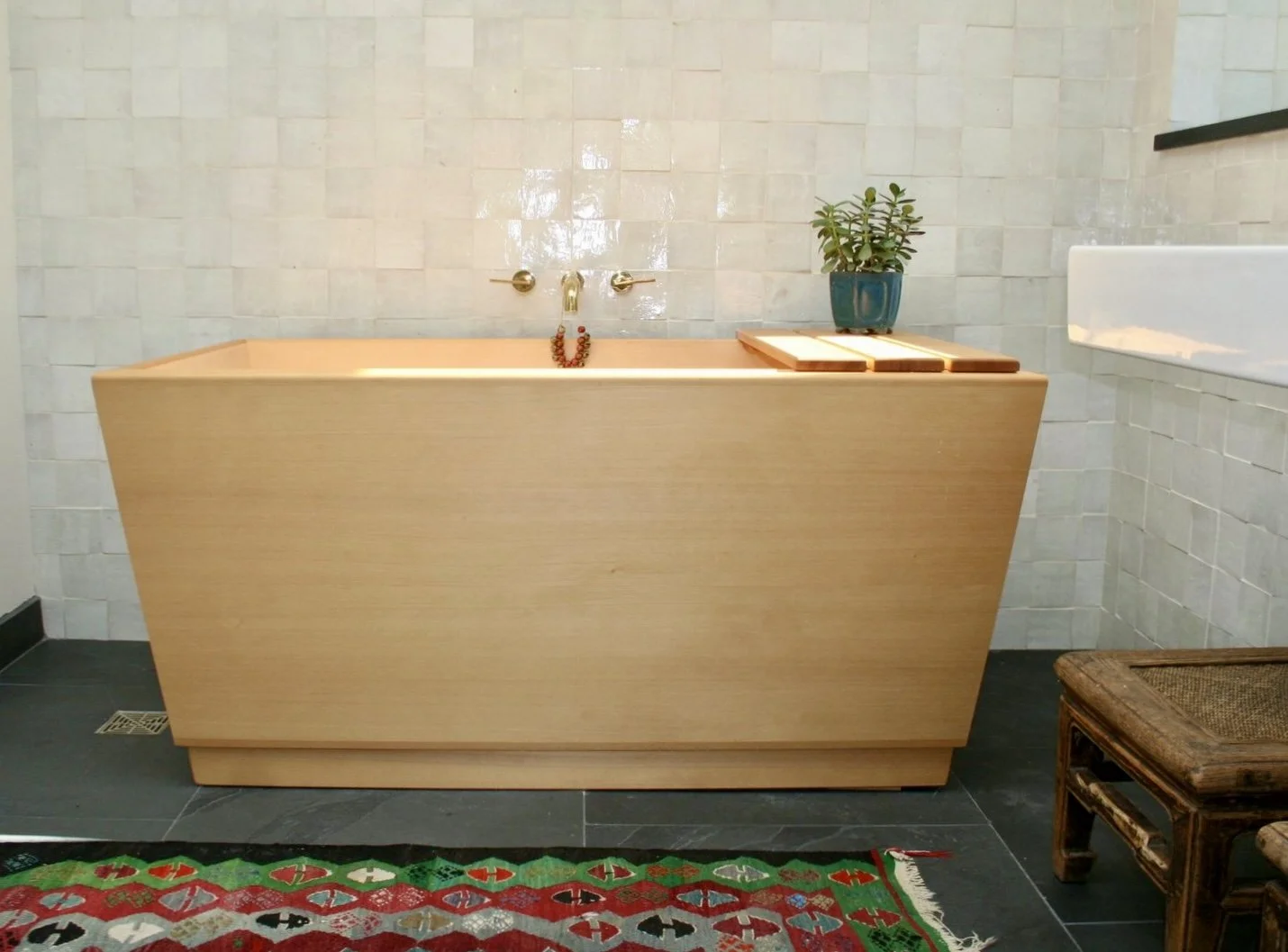 zellige tile bathroom and wood soaking tub