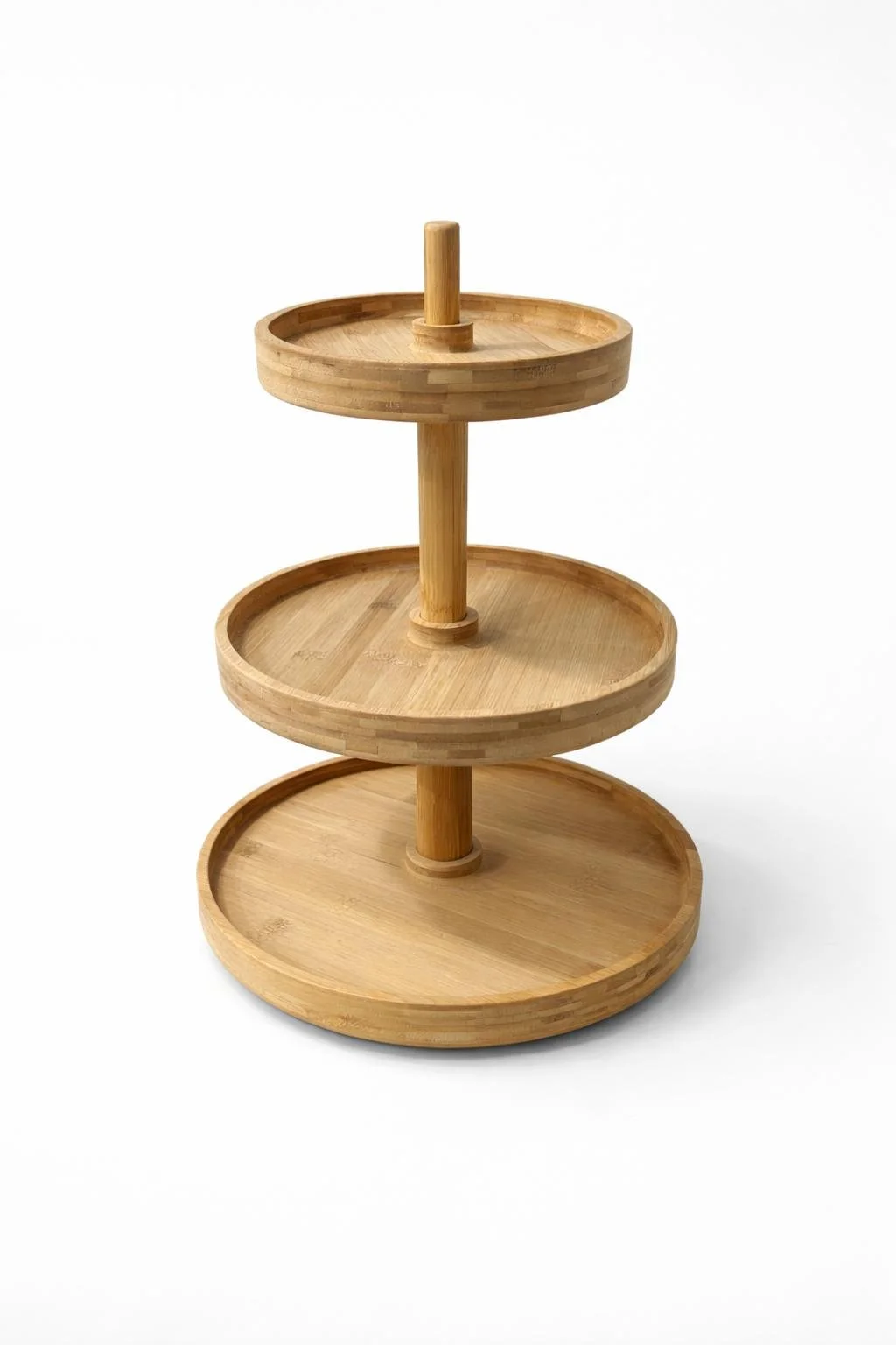 A three-tier wooden serving stand with round trays on a white background.