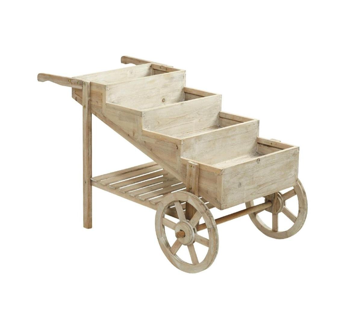 Wooden plant cart with four tiered sections and two large wheels.