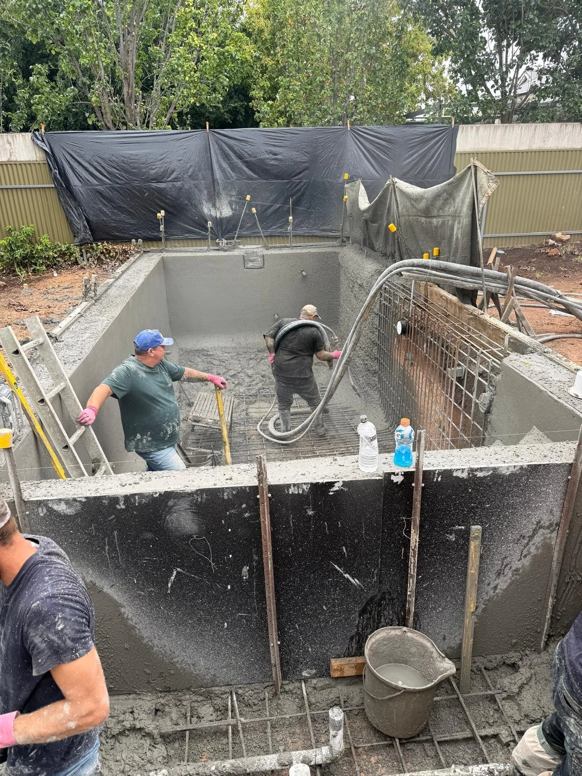 Image of foundation being poured in Carter St backyard