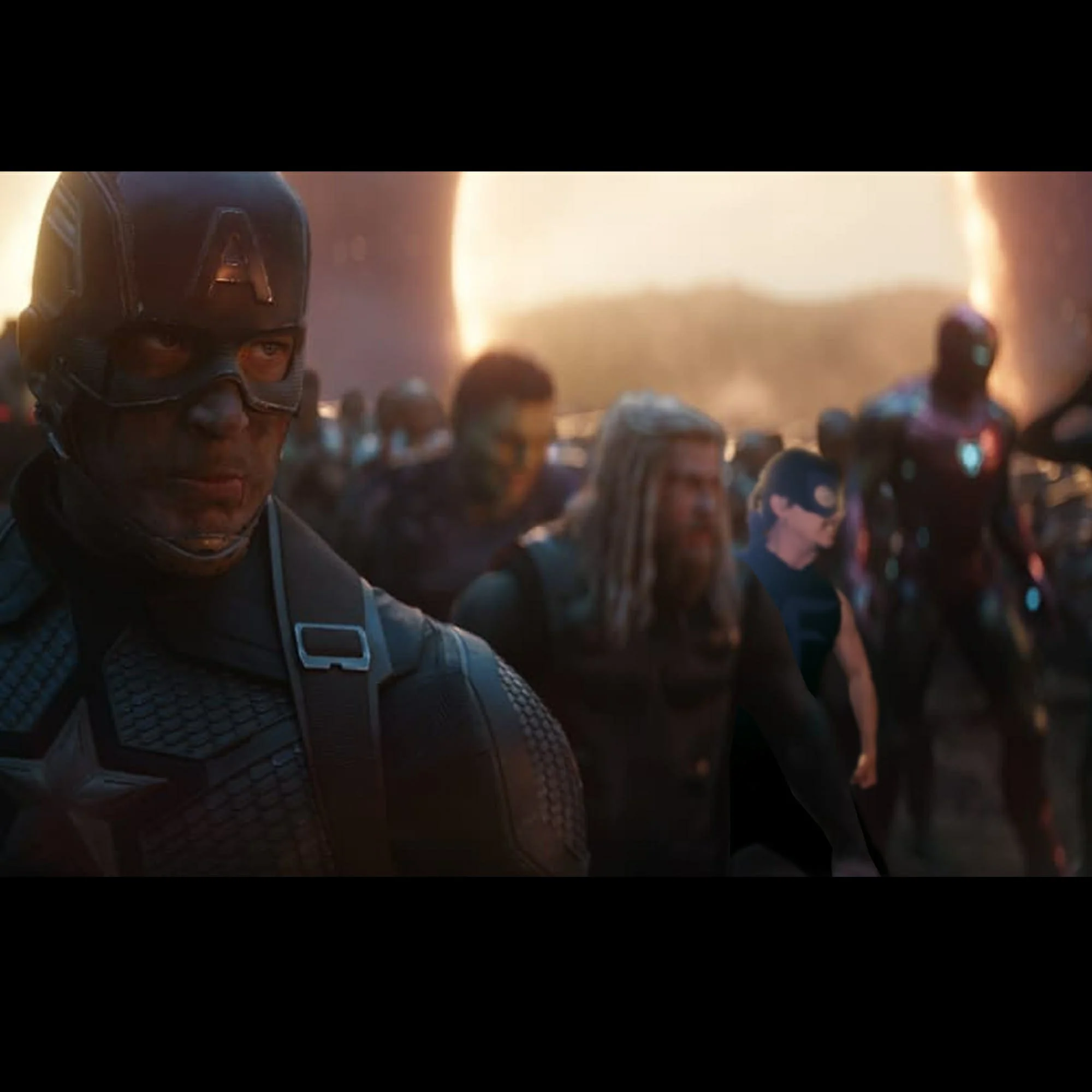 Close-up of a man wearing a futuristic helmet with a lightning bolt symbol, surrounded by a crowd of people in a smoky, illuminated environment.