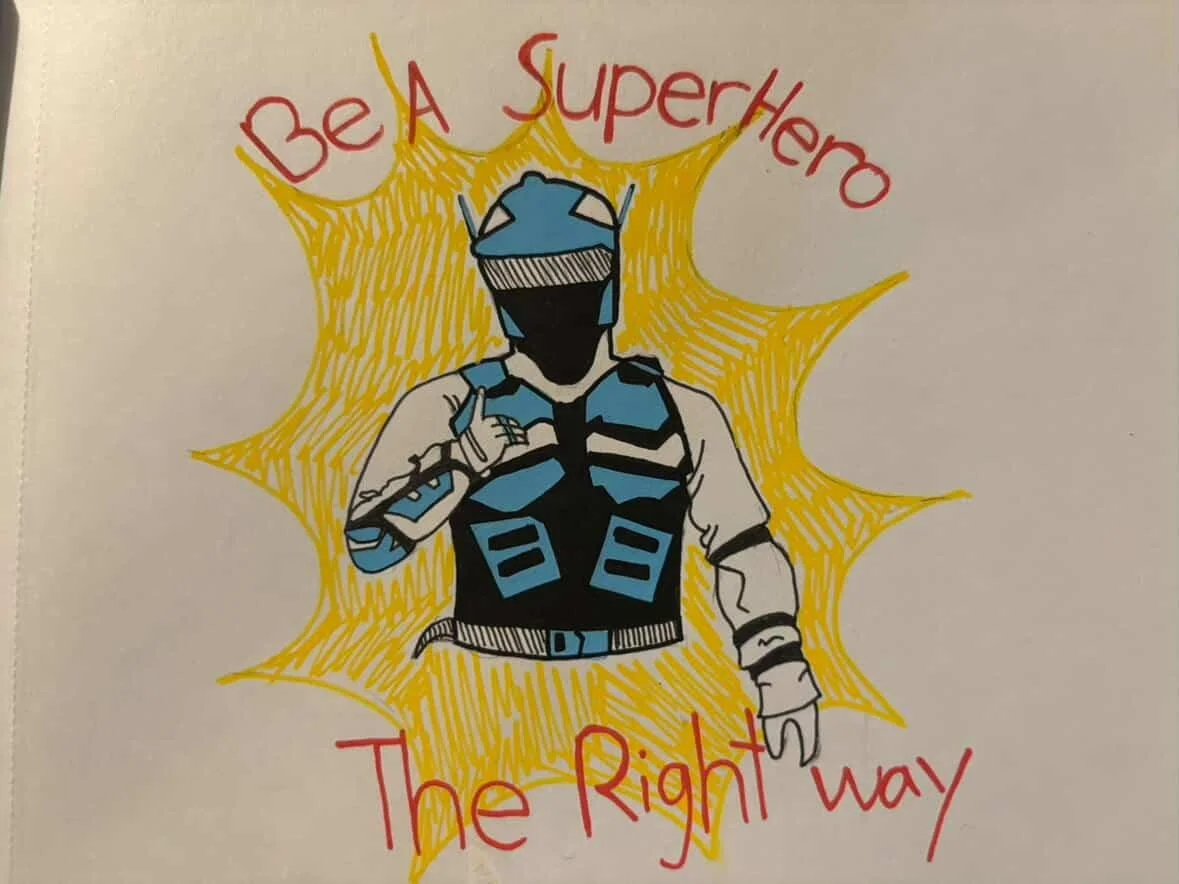 A drawing of a superhero wearing a blue and black suit with a face mask, giving a thumbs-up, surrounded by a yellow starburst, with red text above and below reading 'Be A Superhero The Right Way'.