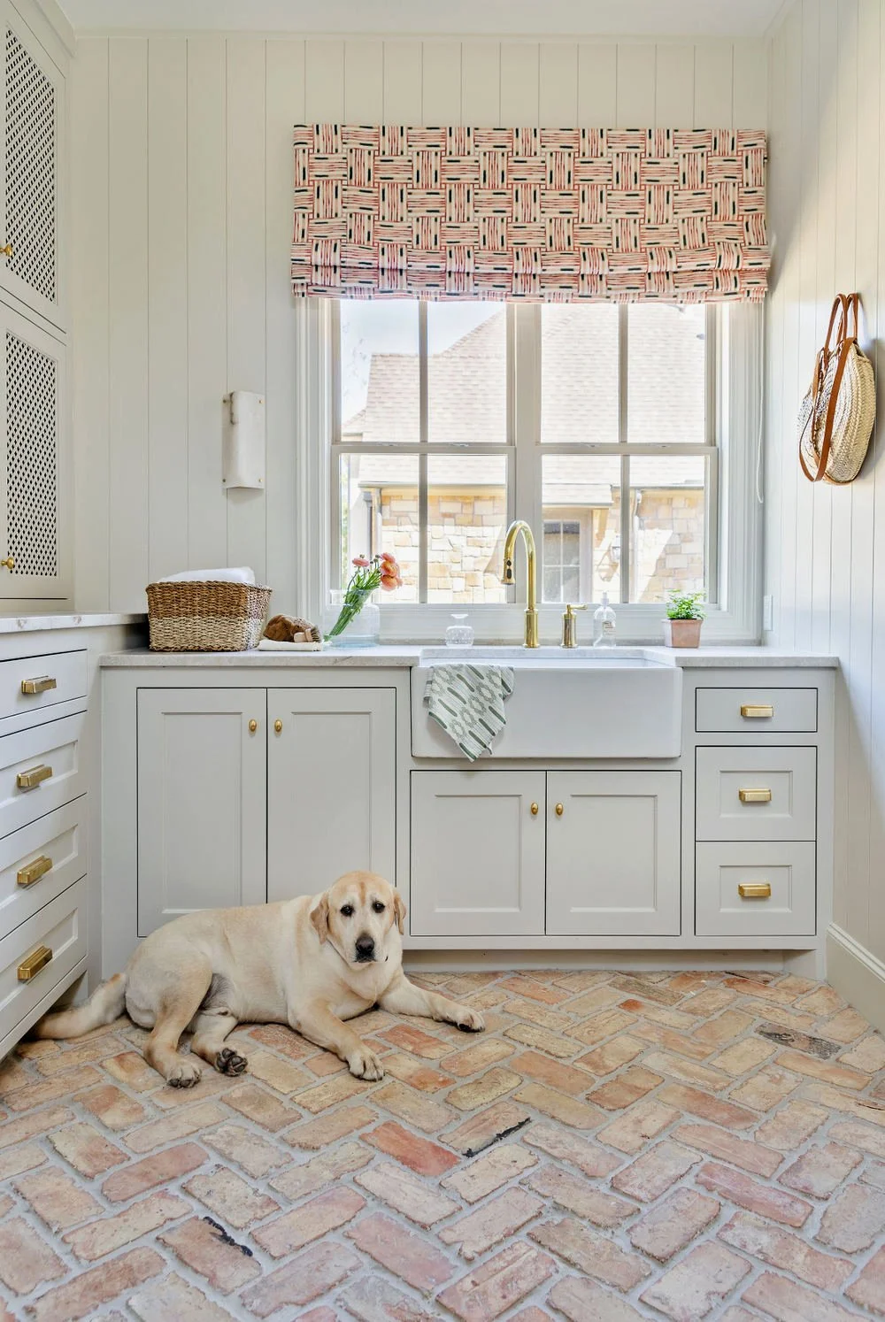 Bright laundry room with terracotta floor tiles – Interior Design Fort Worth, Texas