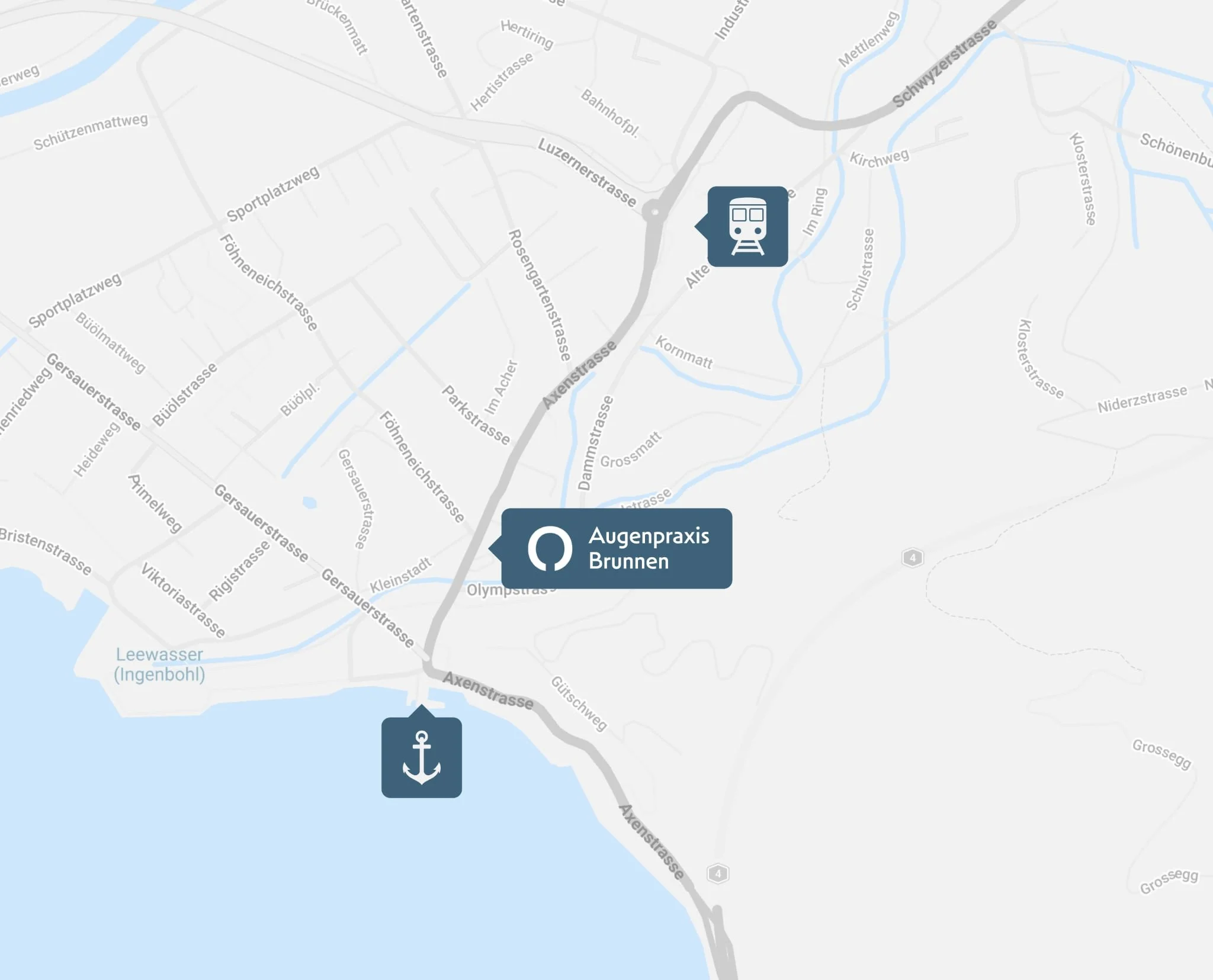 Karte mit Standort von Augenarztpraxis Brunnen, einem Hafen mit Anker-Symbol und einer Bahnstation am oberen Rand.