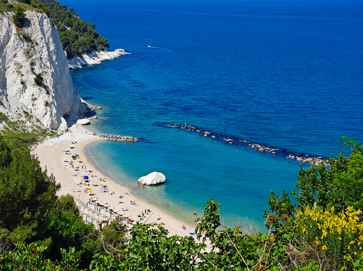 Turquoise water, white cliffs and the distinctive Bò rock at Spiaggia del Frate in Numana, Le Marche, Italy