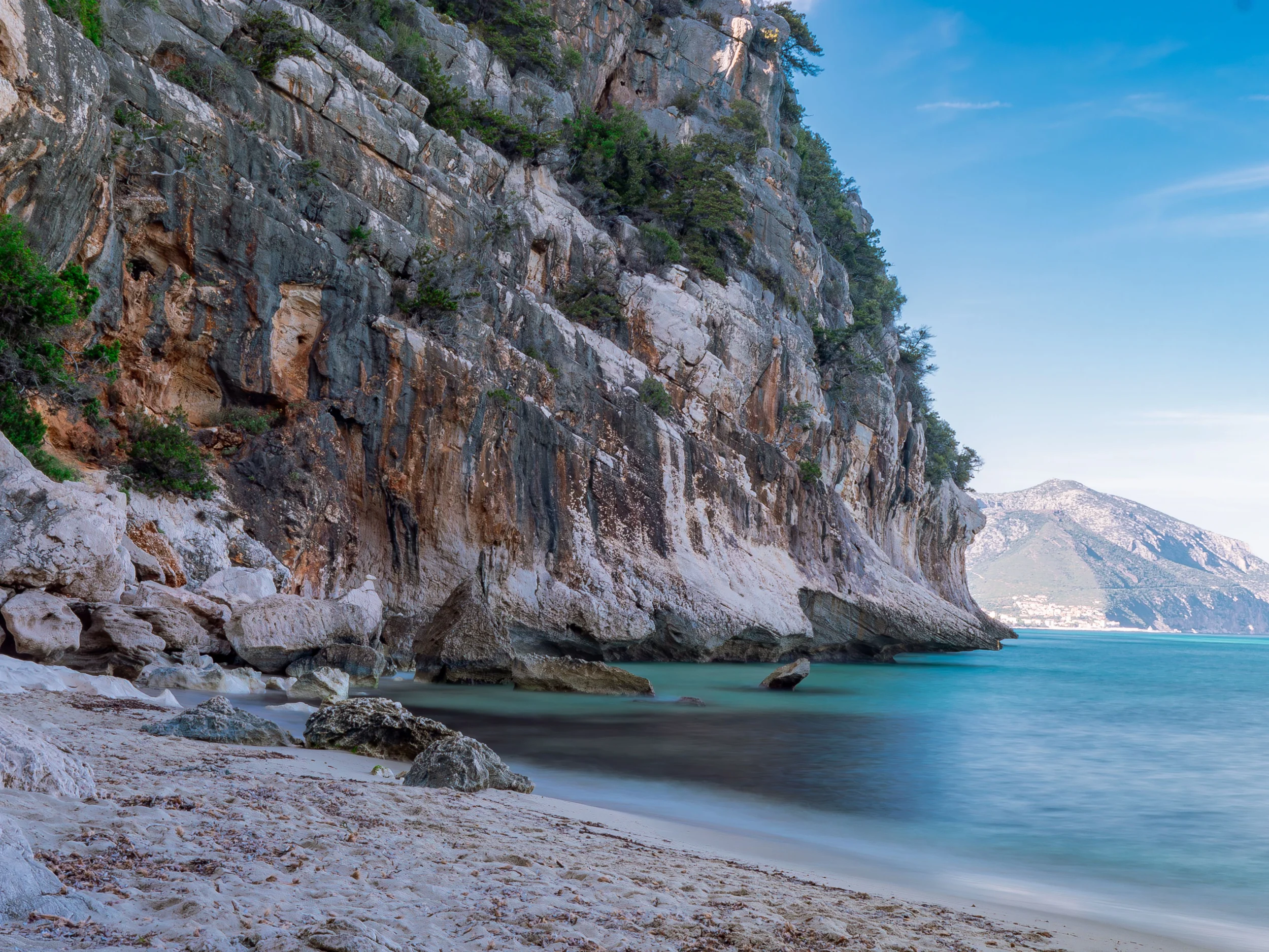 Dramatic limestone cliffs and turquoise water along the Gulf of Orosei in Sardinia