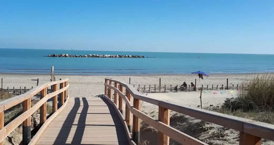 Wooden walkway leading to the sandy Adriatic beach at Casalborsetti