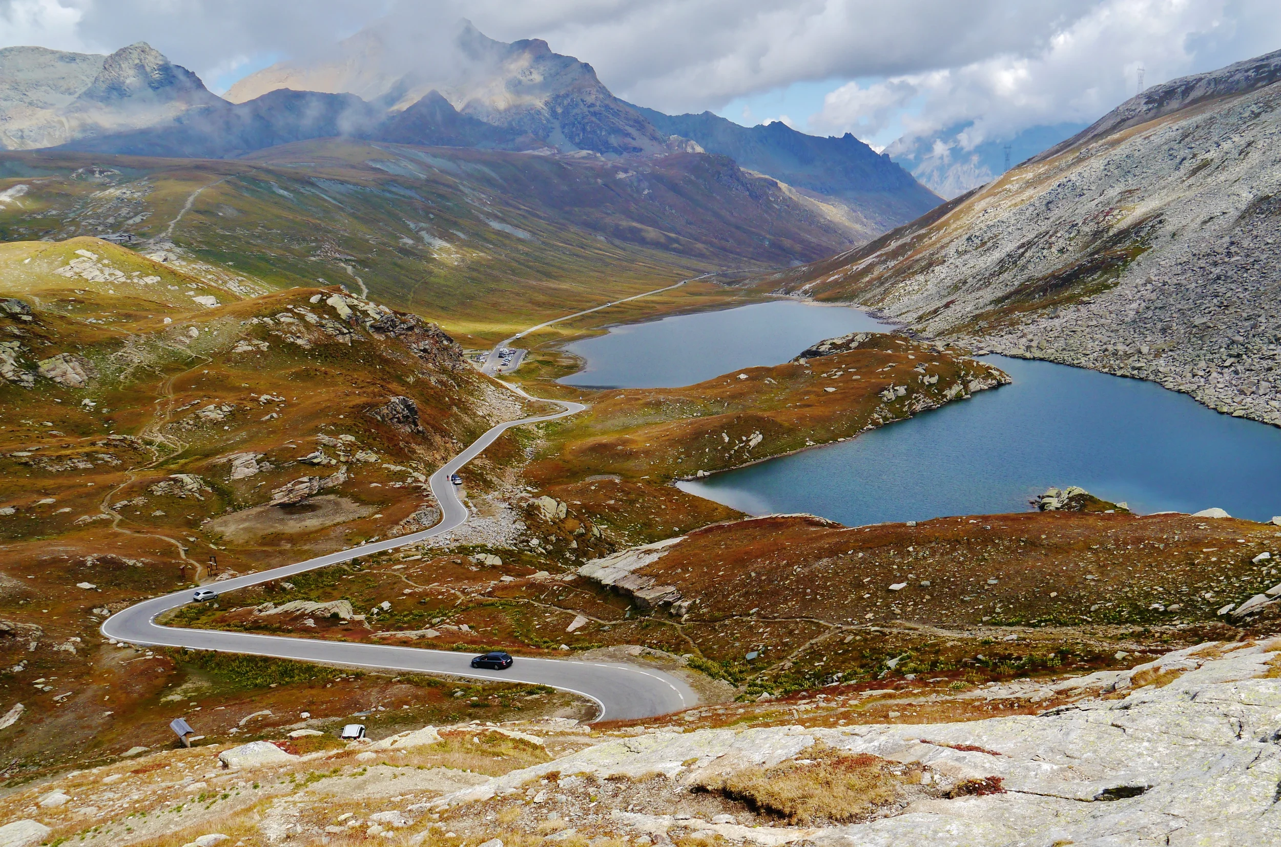 The winding Nivolet road beside high Alpine lakes and rocky slopes.