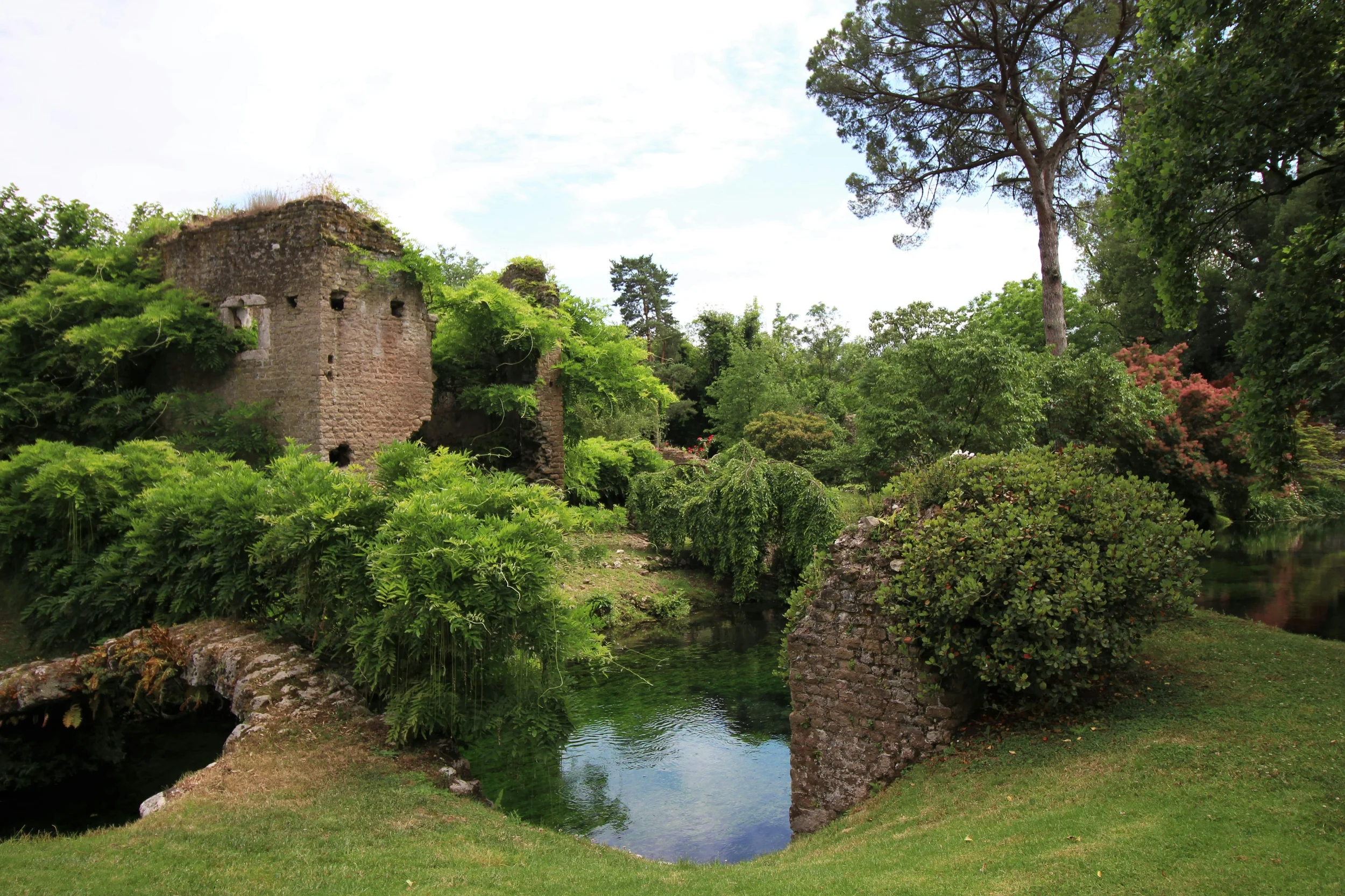Giardino di Ninfa with lush gardens, medieval ruins and Mediterranean vegetation in Lazio, Italy