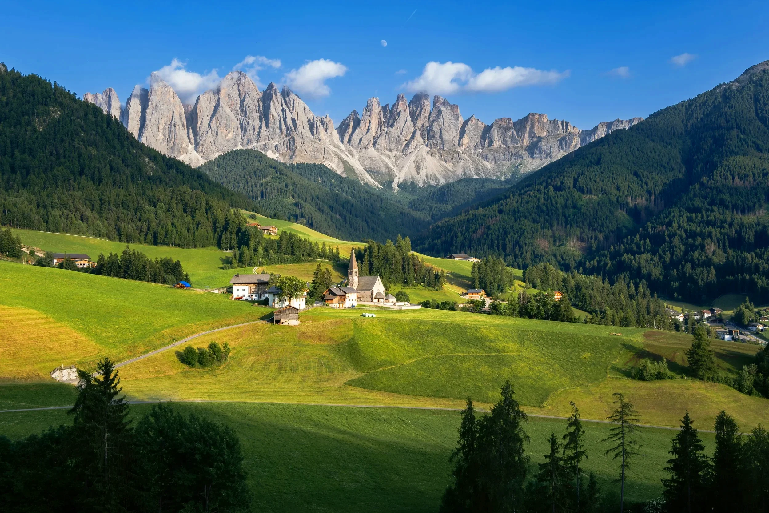 Val di Funes with traditional villages beneath the Odle peaks in Trentino-Alto Adige, Italy