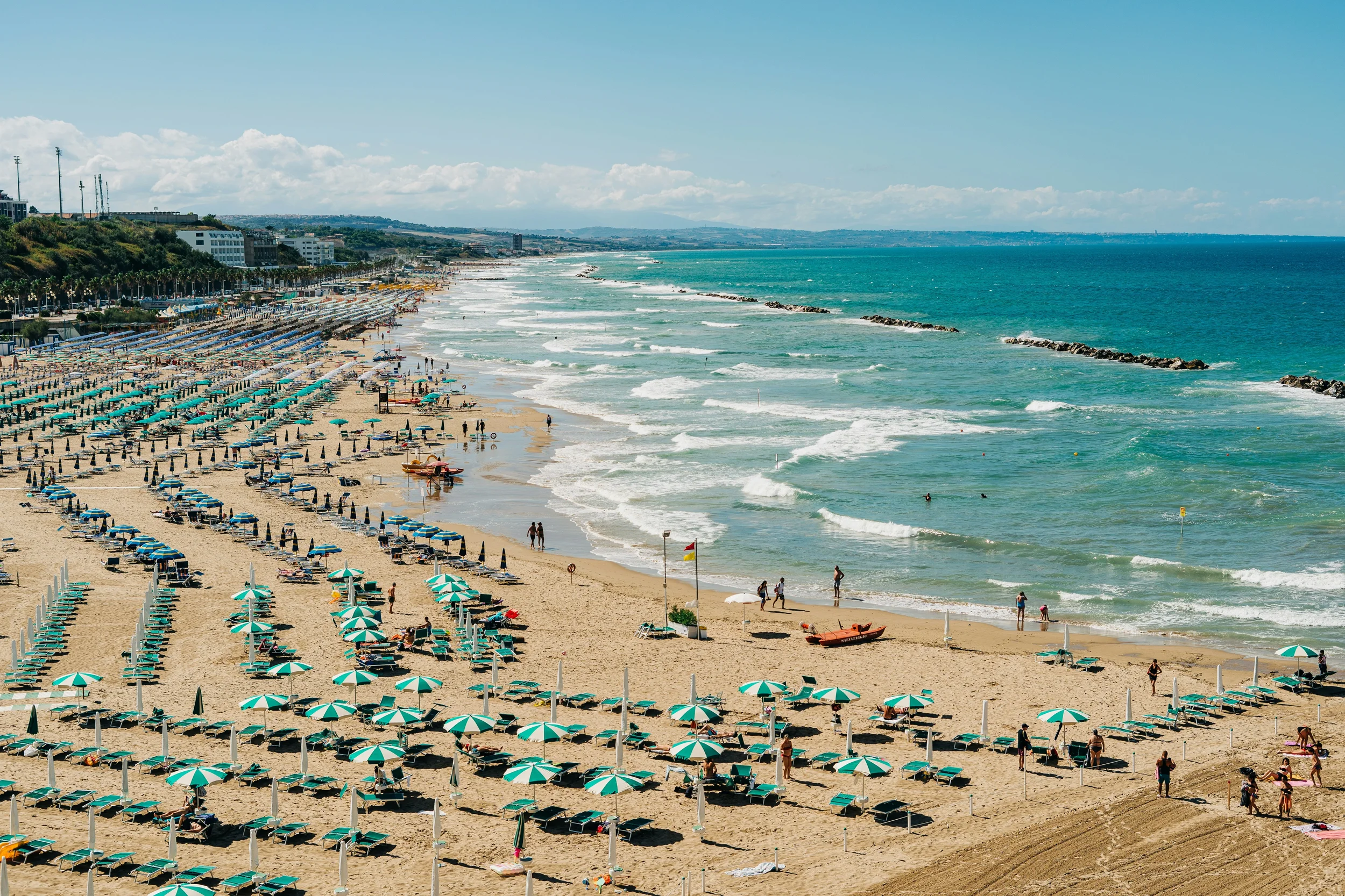 Rows of parasols along Sant’Antonio Beach and the turquoise Adriatic Sea in Termoli, Molise