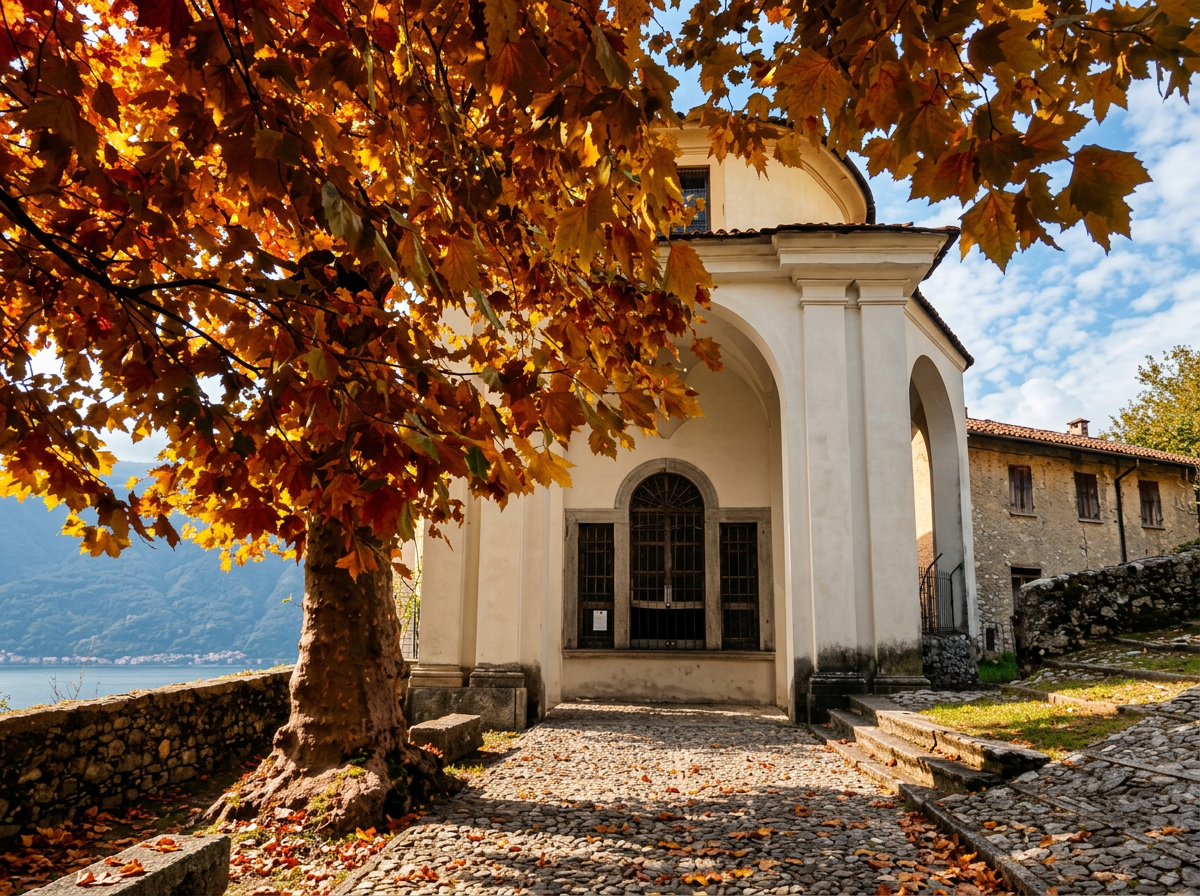 Chapel on the Sacro Monte di Ossuccio path overlooking Lake Como through autumn leaves