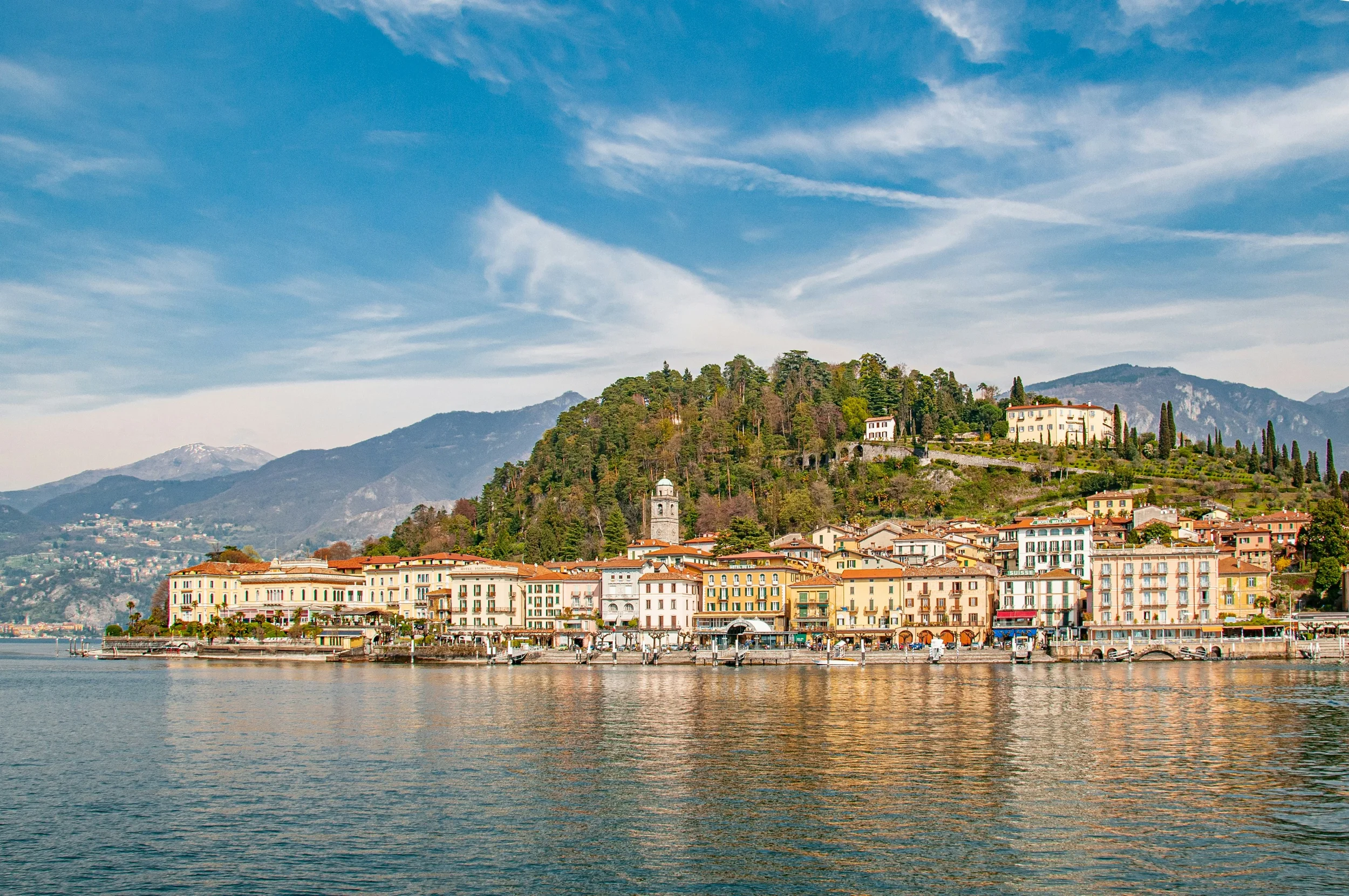 Bellagio waterfront and hillside villas seen from a boat on Lake Como, Lombardia
