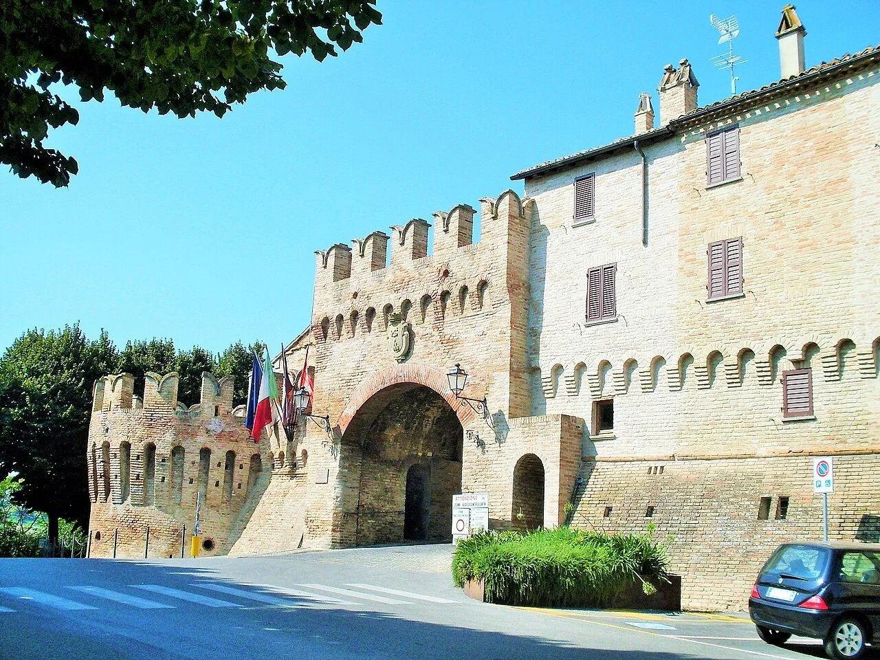 The crenellated brick gateway and defensive walls of Porta Nuova in Corinaldo
