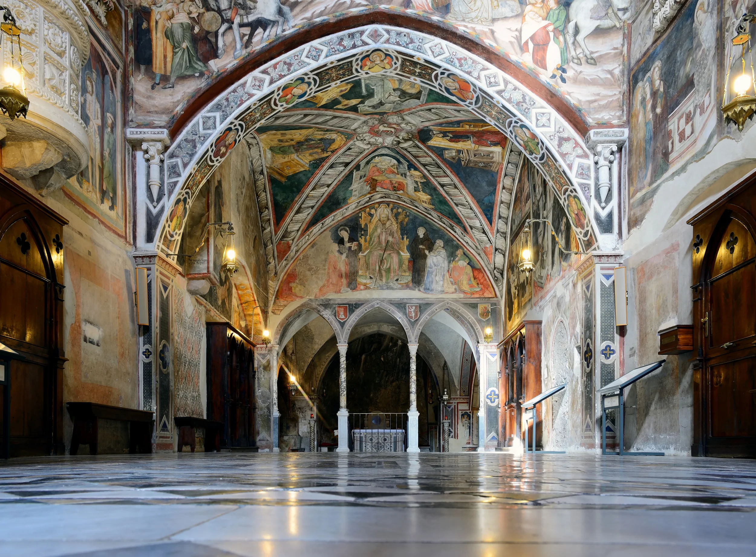 Fresco-covered walls and vaulted arches inside the Sacro Speco monastery in Subiaco.