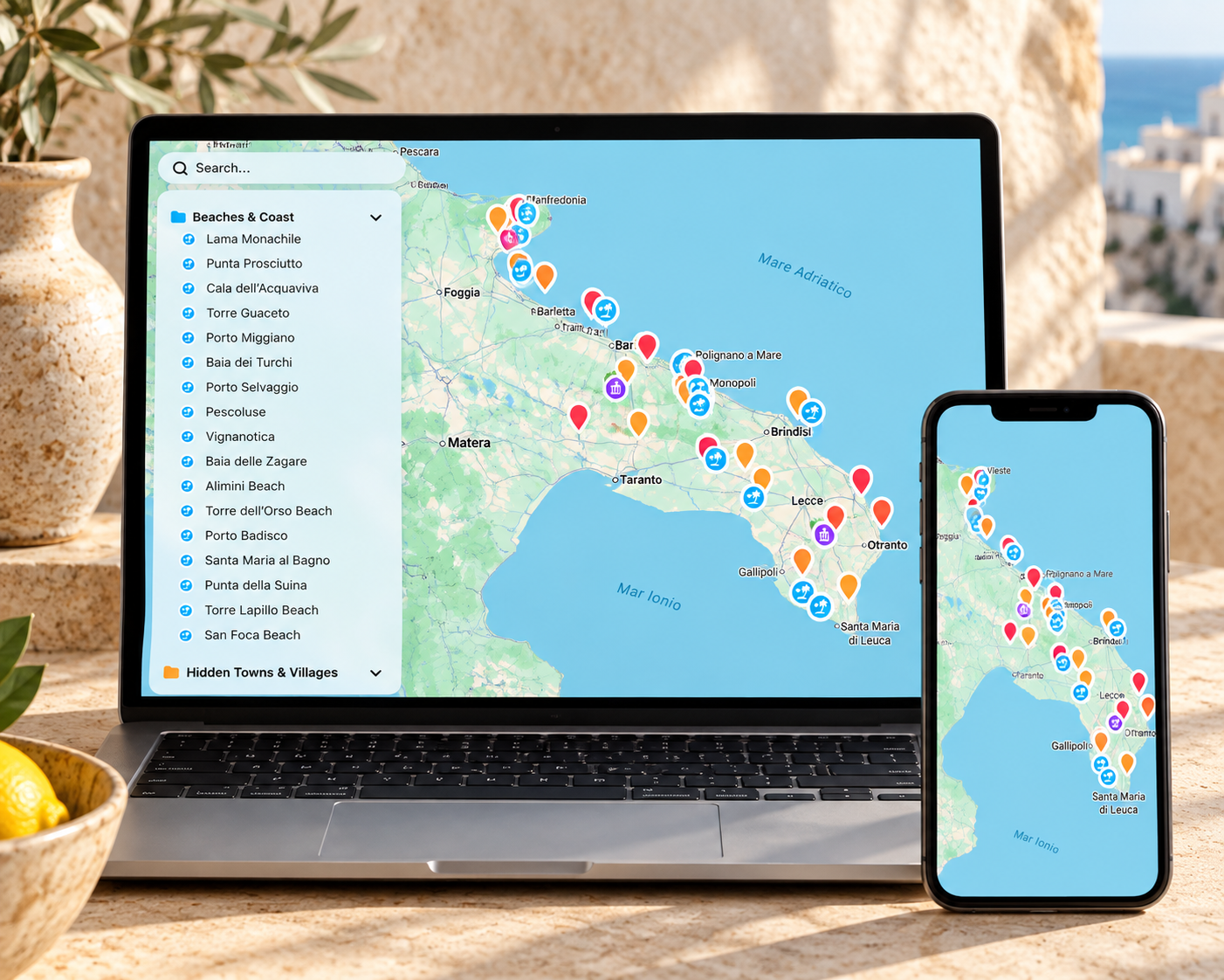 Hidden Italy’s Puglia travel map on a laptop and smartphone, showing colour-coded pins for towns, beaches and coastal viewpoints.