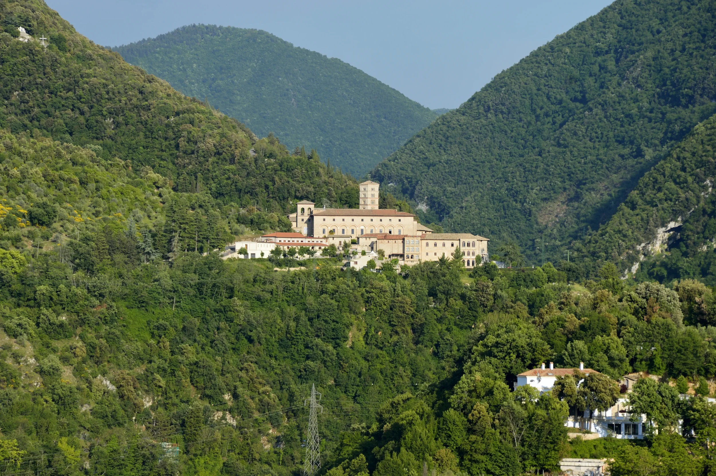 The Monastery of Santa Scolastica in Subiaco, surrounded by wooded mountains in the Aniene Valley.