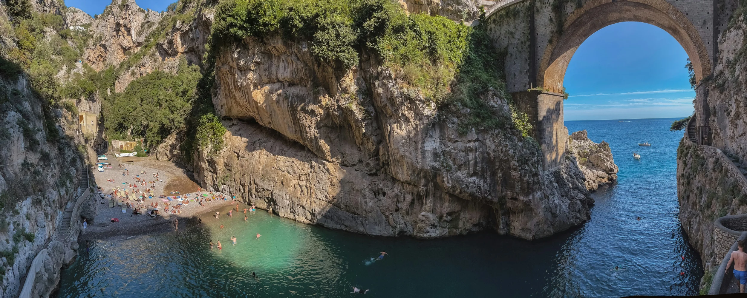 Fiordo di Furore with its small beach, dramatic gorge and iconic bridge on the Amalfi Coast