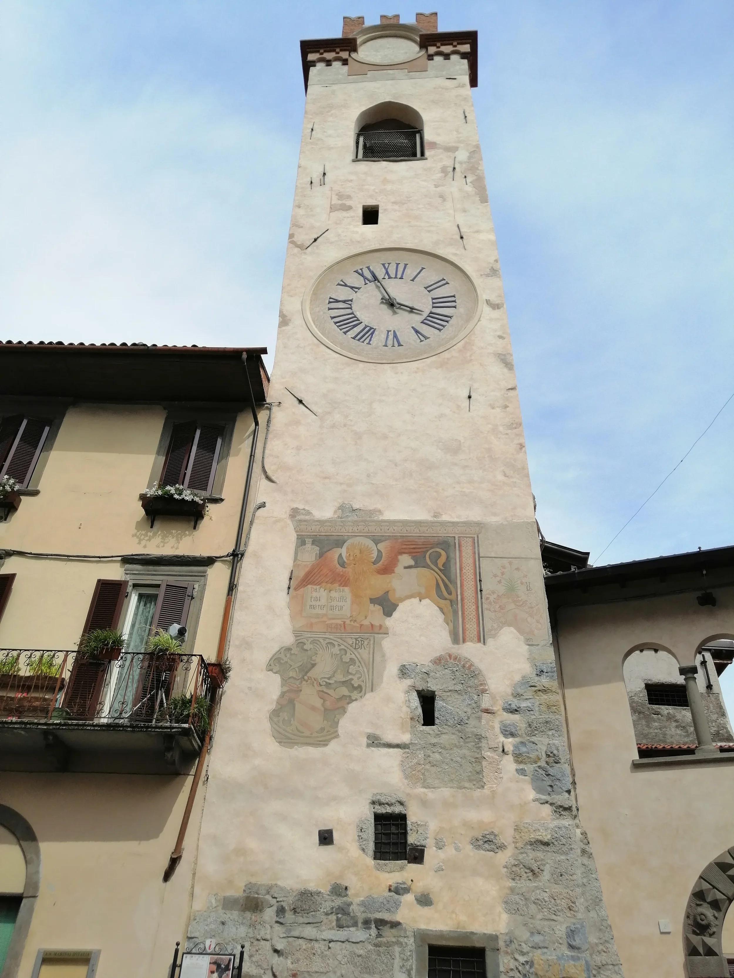 Lovere’s Civic Tower, with its clock face and painted Lion of Saint Mark above the historic square.