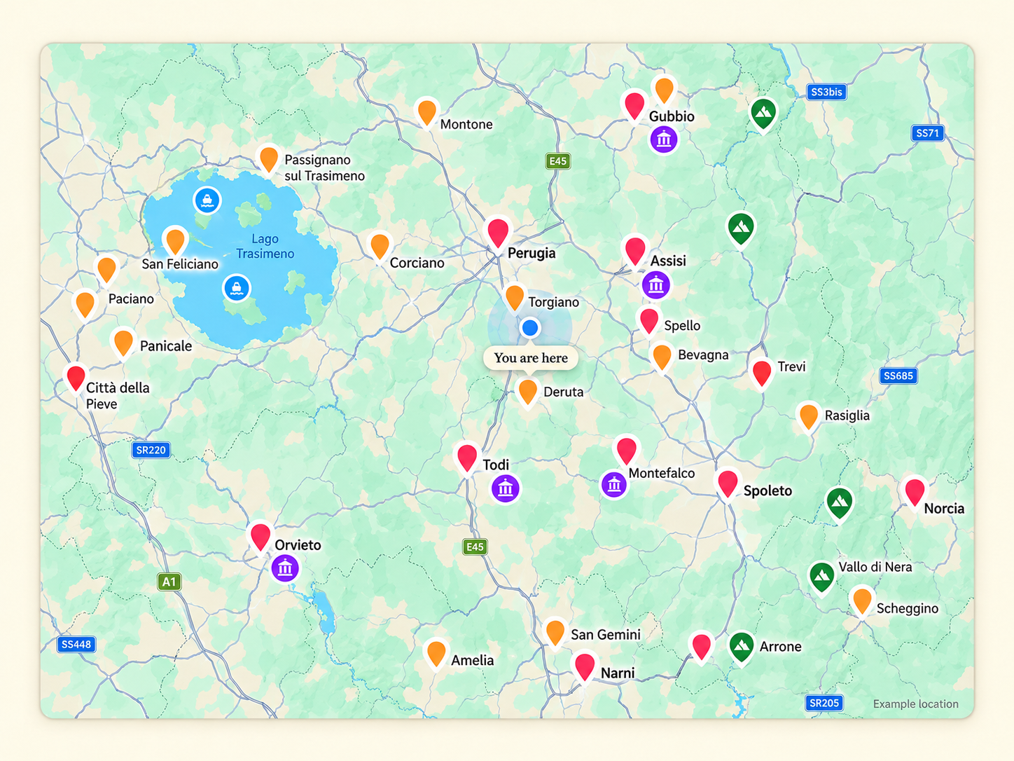 Illustrative Umbria map preview with a blue You are here example location surrounded by many coloured destination pins.