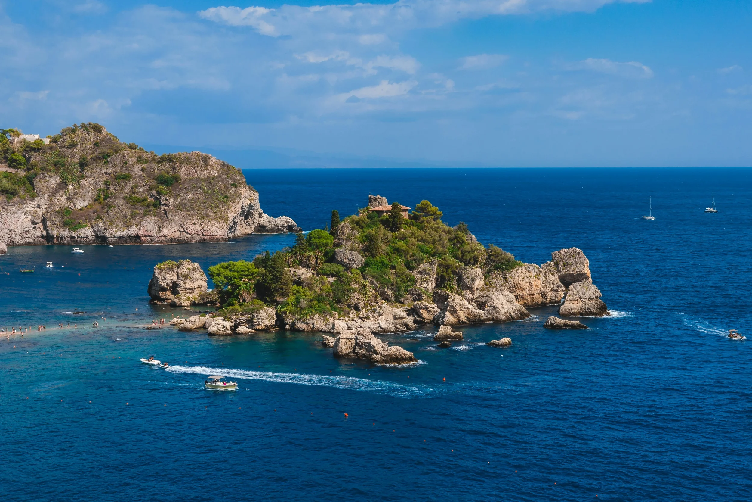 Isola Bella and its turquoise bay below Taormina on the eastern coast of Sicily, Italy.